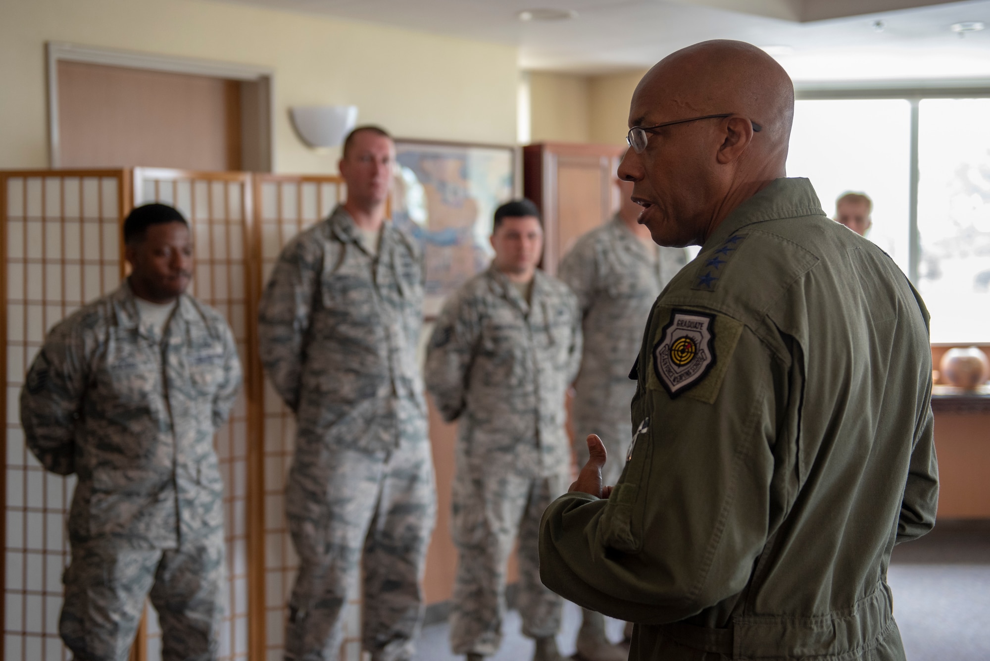 Gen. CQ Brown, Jr., Pacific Air Forces commander, takes a moment to speak with some of the 374th Airlift Wing’s outstanding performers at Yokota Air Base, Japan, Aug. 8, 2018. This was Brown’s first trip to the region since taking command on July 26, 2018.