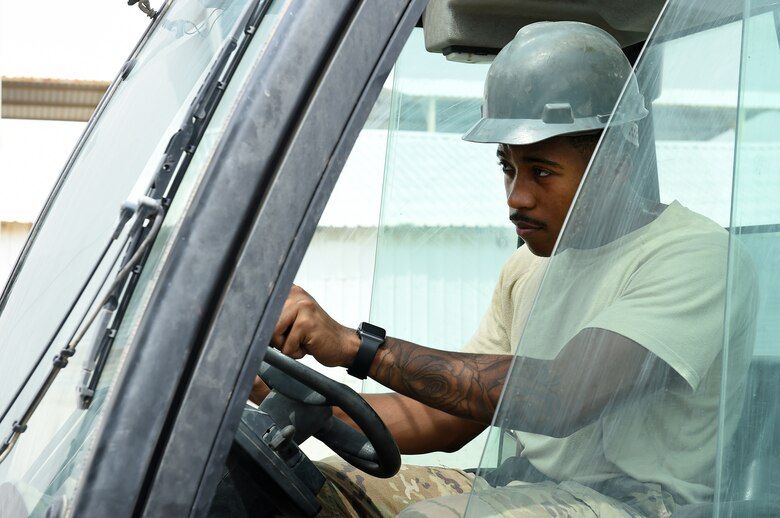 An Airman operates a forklift