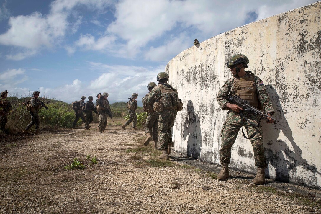 Malaysian and U.S. Marines secure an objective.