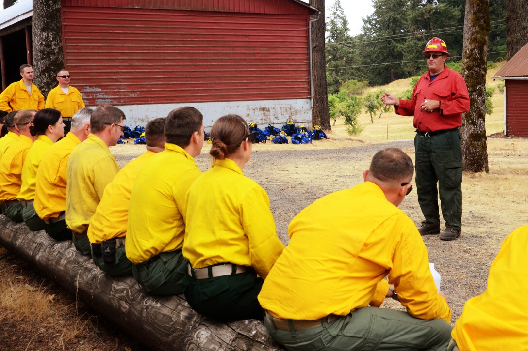 Soldiers receive firefighting technique instructions before training.