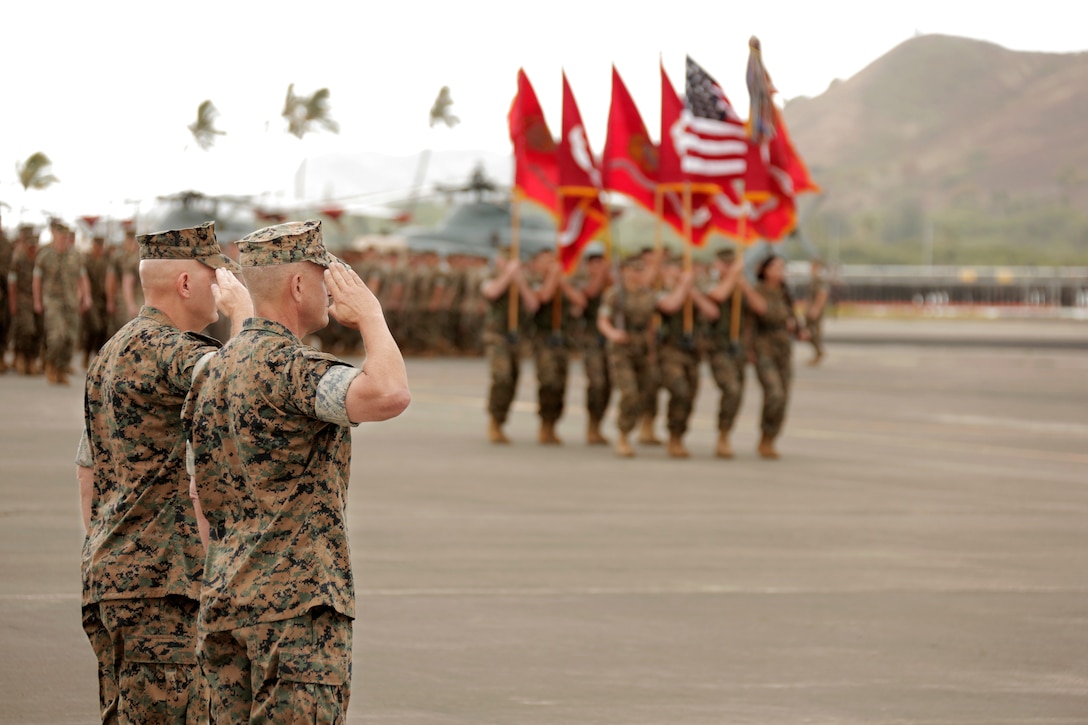 U.S. Marine Corps Lt. Gen. David H. Berger, left, outgoing commander of U.S. Marine Corps Forces, Pacific, and Lt. Gen. Lewis A. Craparotta, incoming commander of MARFORPAC, salute the colors as they pass in review during the MARFORPAC change of command ceremony at Marine Corps Base Hawaii, Aug. 8, 2018. The change of command ceremony represents the transfer of responsibility and authority over MARFORPAC between commanders.