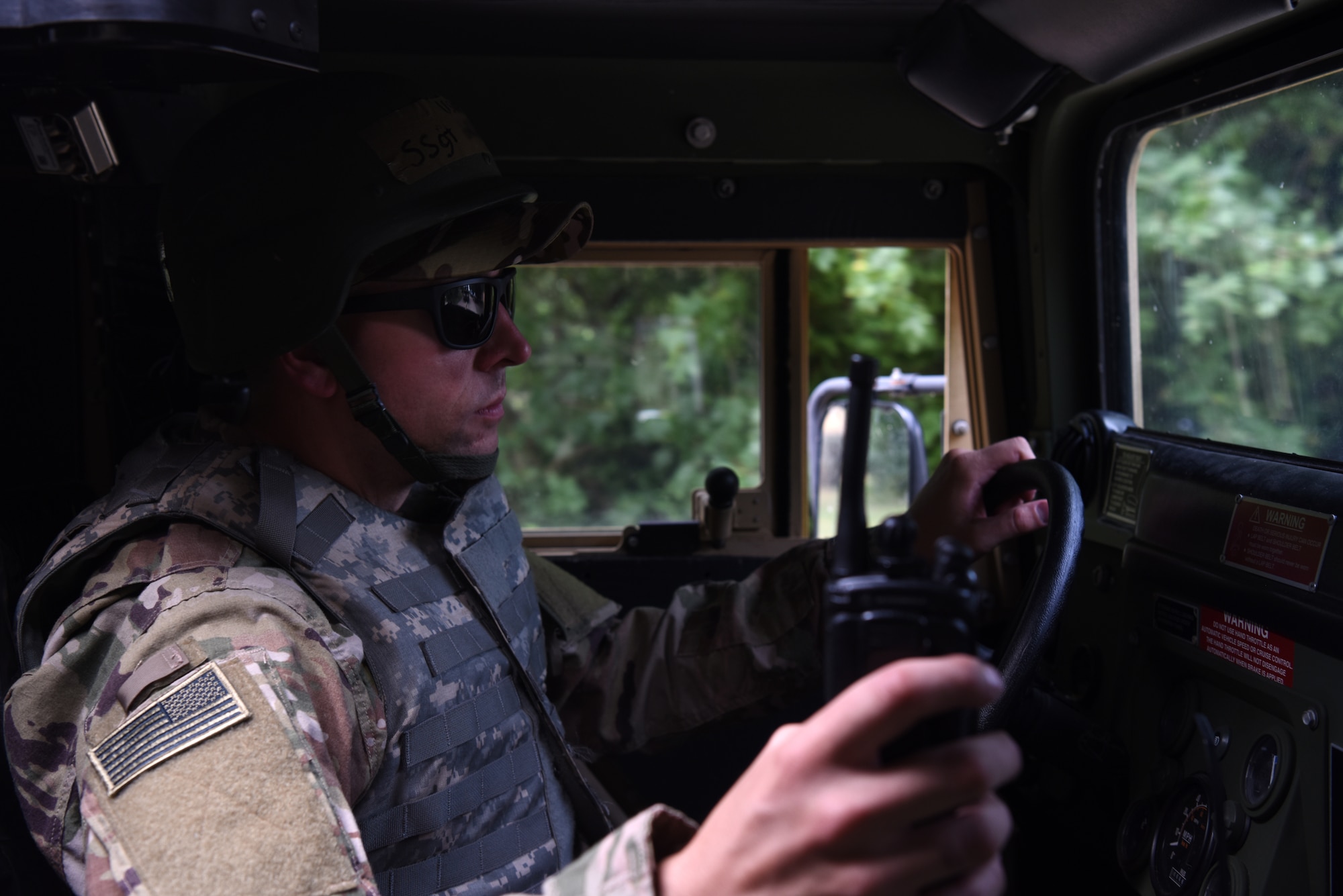 A ground transportation specialist assigned to the 48th Logistics Readiness Squadron drives an up-armored Humvee through the Stanford Training Area, Suffolk, England, Aug. 4, 2018. ground transportation specialist are trained on how to dispatch, operate, and service motor vehicles such as general and special purpose, base maintenance, and material handling vehicles from small forklifts to cargo trucks, busses, container loaders and semi-trailer trucks. (U.S. Air Force photo/ Airman 1st Class John A. Crawford)