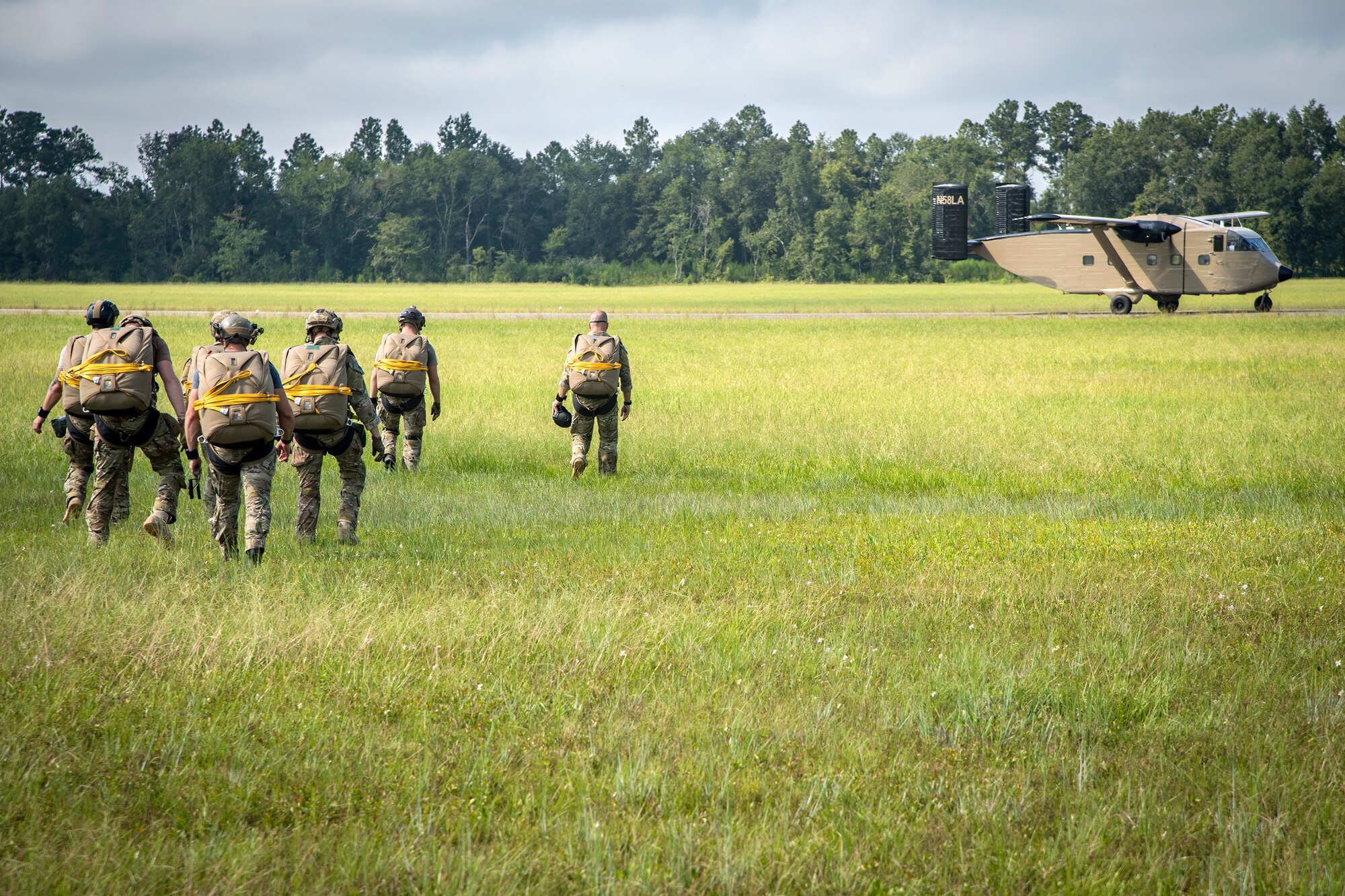 Pararescuemen (PJ) from the 38th Rescue Squadron (RQS), walk en-route to board a Short SC-7 Skyvan, July 24, 2018, in Valdosta, Ga. PJs performed static-line jumps to maintain their jump proficiency qualifications. The mission of the 38th RQS is to employ combat ready rescue officers and pararescuemen to support units worldwide. (U.S. Air Force photo by Airman 1st Class Eugene Oliver)