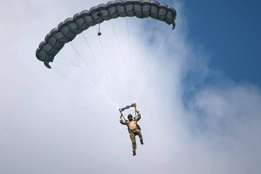 A Pararescueman from the 38th Rescue Squadron, descends after conducting a static-line jump from a Short SC-7 Skyvan, July 24, 2018, in Valdosta, Ga. PJs performed static-line jumps to maintain their jump proficiency qualifications. The mission of the 38th RQS is to employ combat ready rescue officers and pararescuemen to support units worldwide. (U.S. Air Force photo by Airman 1st Class Eugene Oliver)