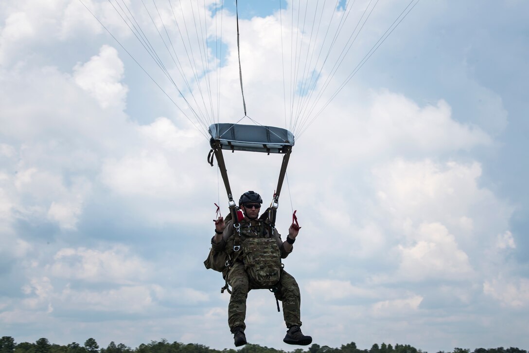 A Pararescueman (PJ) from the 38th Rescue Squadron (RQS), drifts towards the ground, July 24, 2018, in Valdosta, Ga. PJs performed static-line jumps to maintain their jump proficiency qualifications. The mission of the 38th RQS is to employ combat ready rescue officers and pararescuemen to support units worldwide. (U.S. Air Force photo by Airman 1st Class Eugene Oliver)