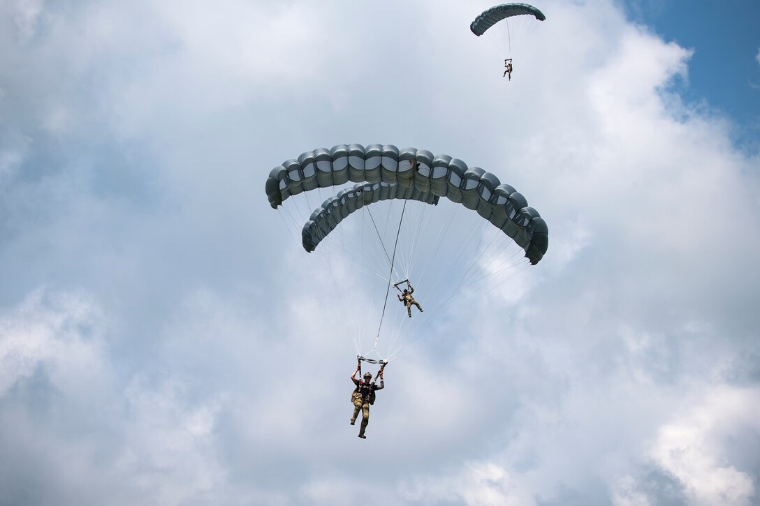 Pararescuemen (PJ) from the 38th Rescue Squadron (RQS), descend after performing static-line jumps from a Short SC-7 Skyvan, July 24, 2018, at Valdosta, Ga. PJs performed static-line jumps to maintain their jump proficiency qualifications. The mission of the 38th RQS is to employ combat ready rescue officers and pararescuemen to support units worldwide. (U.S. Air Force photo by Airman 1st Class Eugene Oliver)