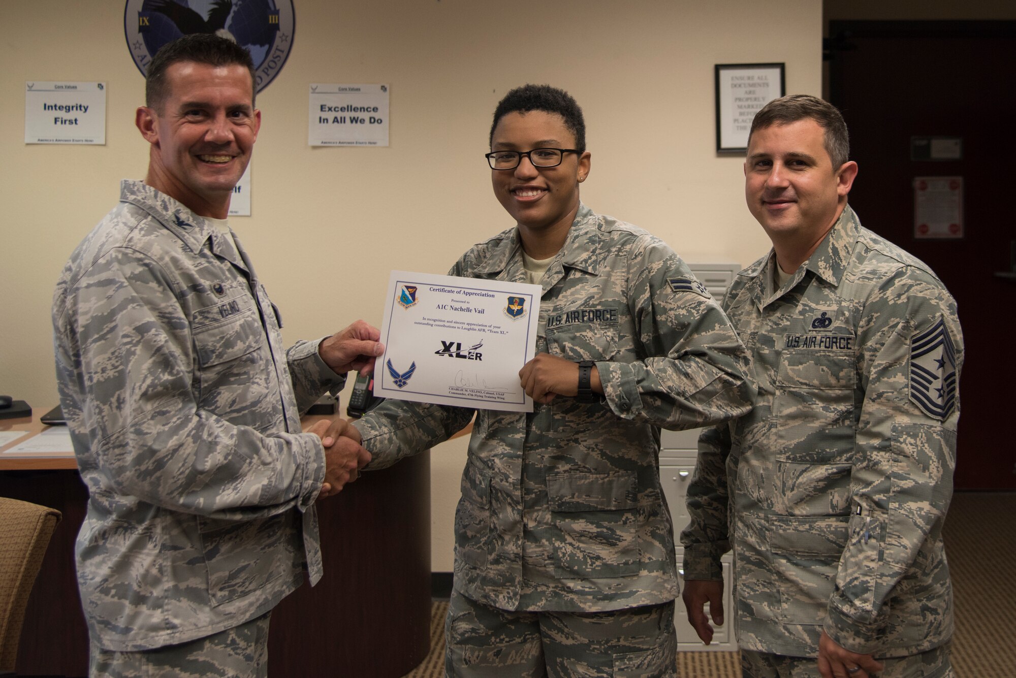 Airman 1st Class Nachelle Vail, 47th Flying Training Wing emergency actions controller, was chosen by wing leadership to be the “XLer” of the week, for the week of July, 30, 2018, at Laughlin Air Force Base, Texas. The “XLer” award, presented by Col. Charlie Velino, 47th Flying Training Wing commander, is given to those who consistently make outstanding contributions to their unit and the Laughlin mission. (U.S. Air Force photo by Airman 1st Class Daniel Hambor)