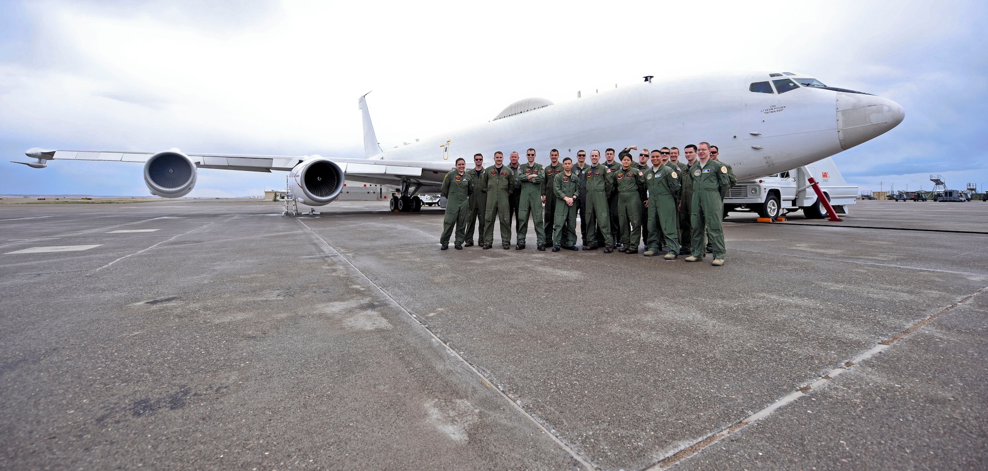 The joint Air Force and Navy crew of an E-6B Mercury Airborne Launch Control System aircraft, stationed with the 625th Strategic Operations Squadron based out of Offutt Air Force Base, Neb., pose for a picture on the tarmac of the Montana Air National Guard flight line in Great Falls, Mont., April 5, 2016. Col. Jonathan Sorbet took over July 2 as senior materiel leader for a division of the Command, Control, Communications, Intelligence and Networks Directorate at Hanscom Air Force Base, Mass. responsible for acquiring the Family of Advanced Beyond Line-of-Sight Terminals, or FAB-T, used on the E-6B. (U.S. Air Force photo by Airman Collin Schmidt)