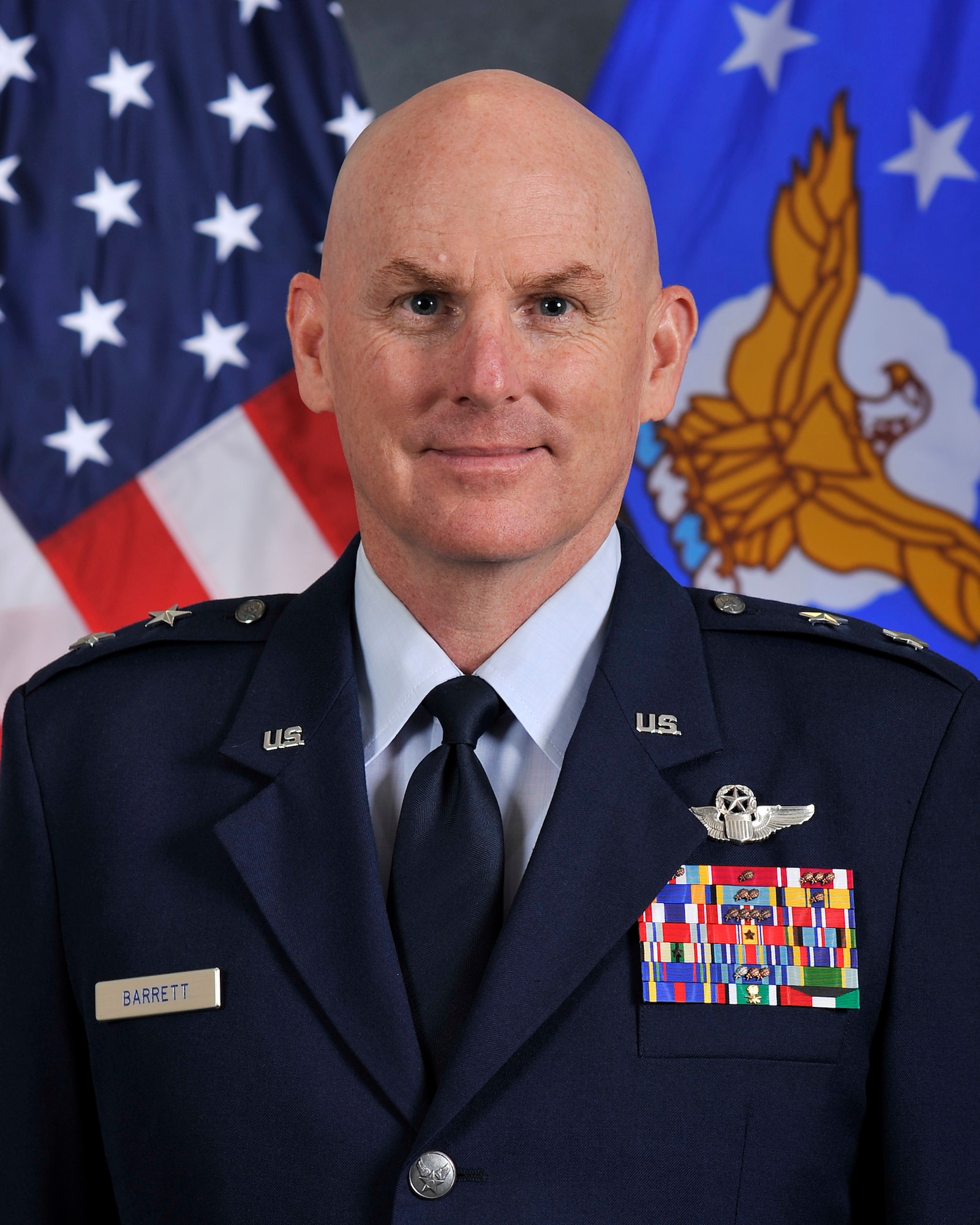 Maj. Gen. Sam Barrett takes the 18th Air Force guidon from Gen. Carlton Everhart, and assumes command of 18th AF during a ceremony July 31, at Scott Air Force Base, Ill. Barrett comes to 18 AF from his position as the Director of operations, Strategic Deterrence and Nuclear Integration, Headquarters Air Mobility Command, Scott AFB. (U.S. Air Force photo by Airman 1st Class Chad Gorecki)