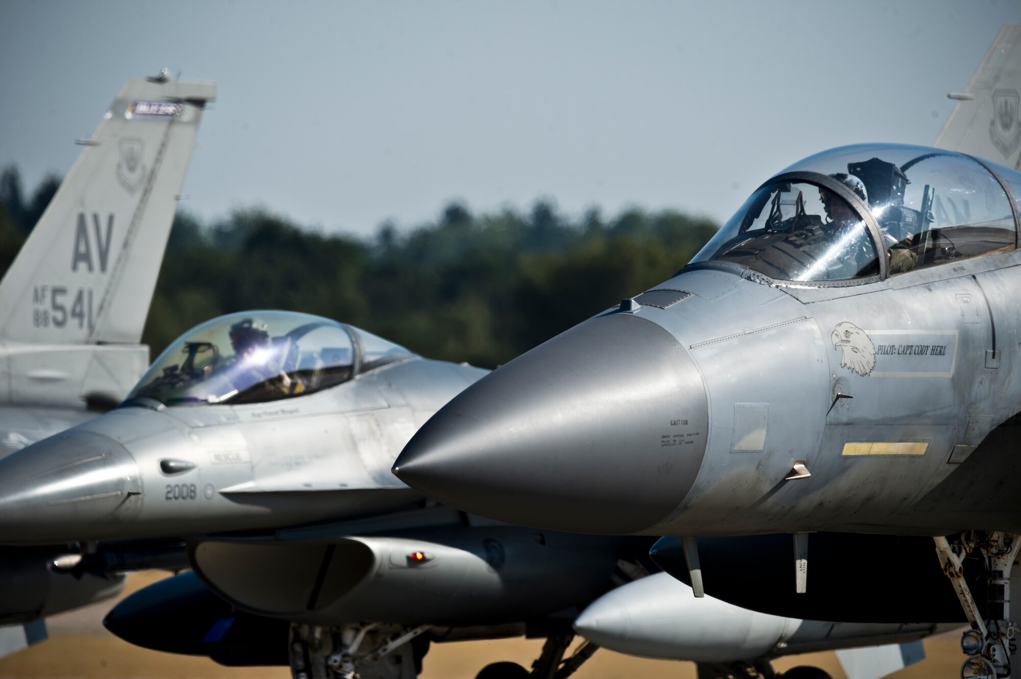 An F-15C Eagle from the 48th Fighter Wing's 493rd Fighter Squadron, and F-16C Fighting Falcons from the 31st Fighter Wing's 510th Fighter Squadron prepare to take off for a training sortie at Royal Air Force Lakenheath, England, Aug. 3, 2018. During a two-week flying training deployment, 14 F-16C aircraft and approximately 200 Airmen from the 31st FW focused on maintaining joint readiness while building interoperability capabilities with NATO and other U.S. Air Force assets. (U.S. Air Force photo by Master Sgt. Eric Burks)