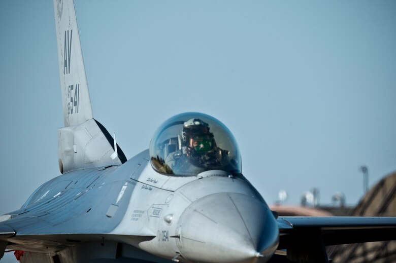 An F-16C Fighting Falcon from the 31st Fighter Wing, 510th Fighter Squadron, Aviano Air Base, Italy, taxis down the flightline at Royal Air Force Lakenheath, England, Aug. 3, 2018. During a two-week flying training deployment to the United Kingdom, the 510th FS "Buzzards" flew approximately 332 hours across 168 sorties. (U.S. Air Force photo by Master Sgt. Eric Burks)