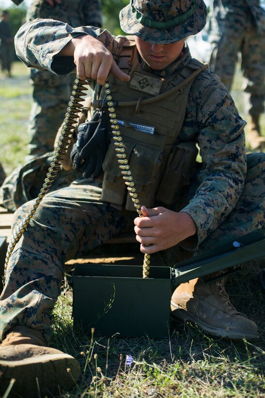 A Marine places ammunition into an ammo can during Exercise Platinum Lion 18.