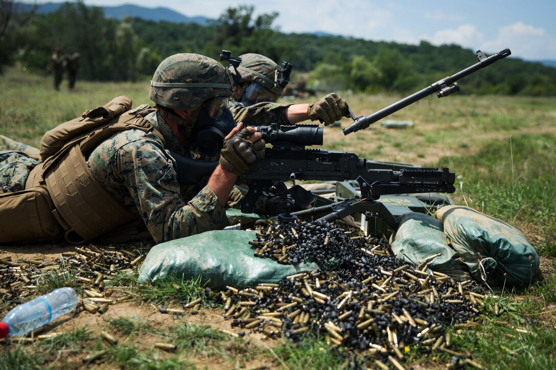 Marines execute a machine gun barrel change during the exercise.