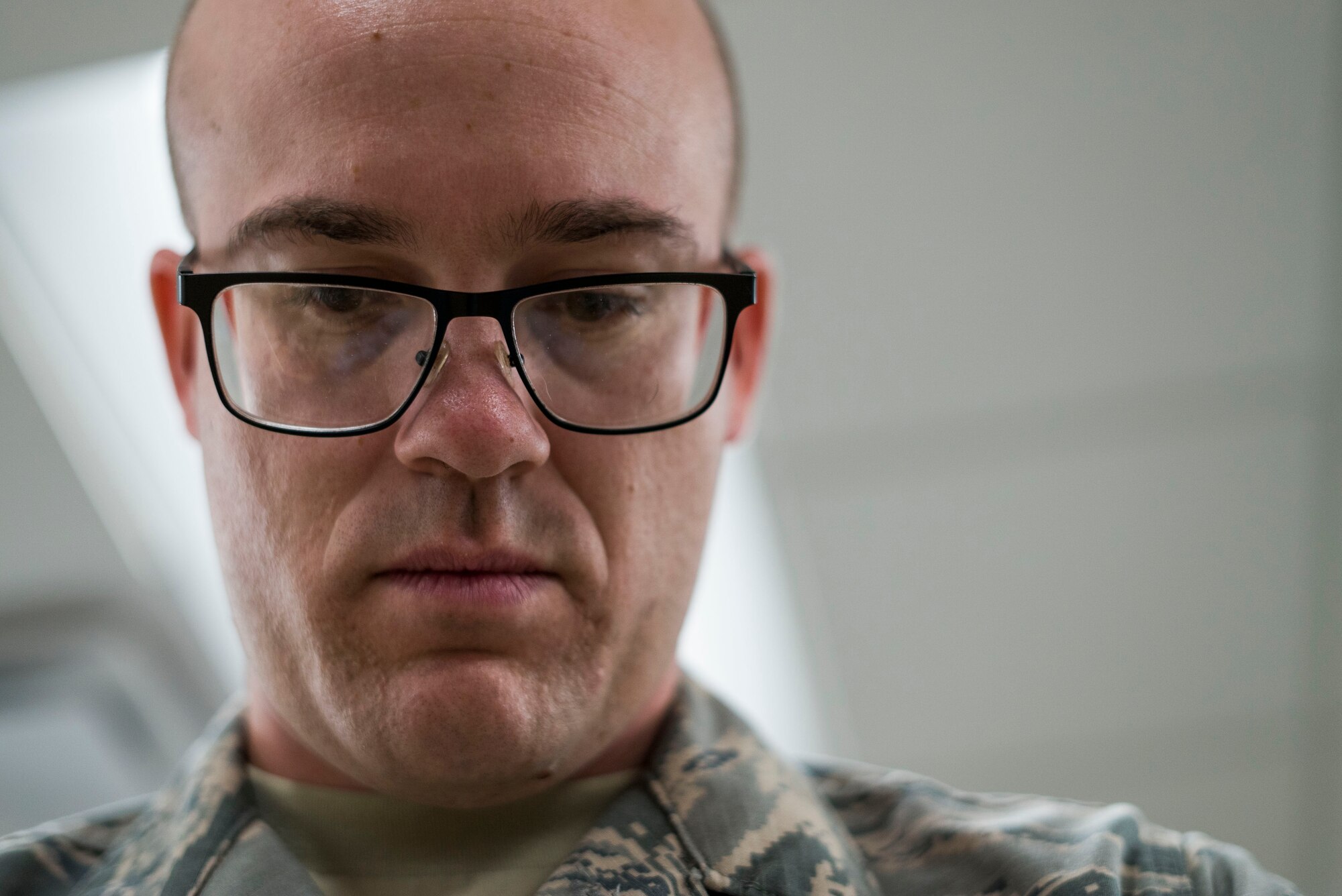 Staff Sgt. Miles Warwick inspects aircrew flight equipment.