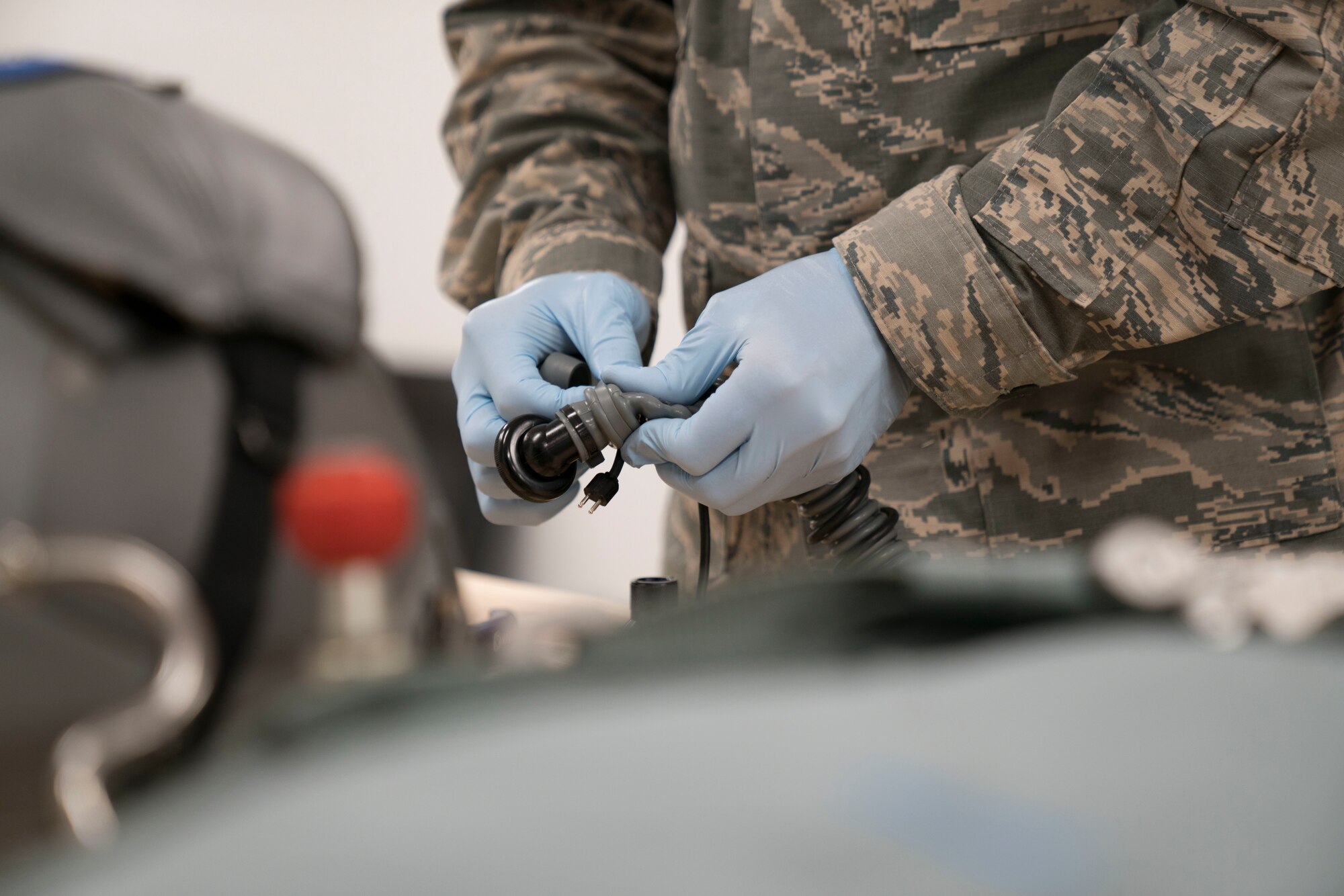 Staff Sgt. Miles Warwick inspects aircrew flight equipment.