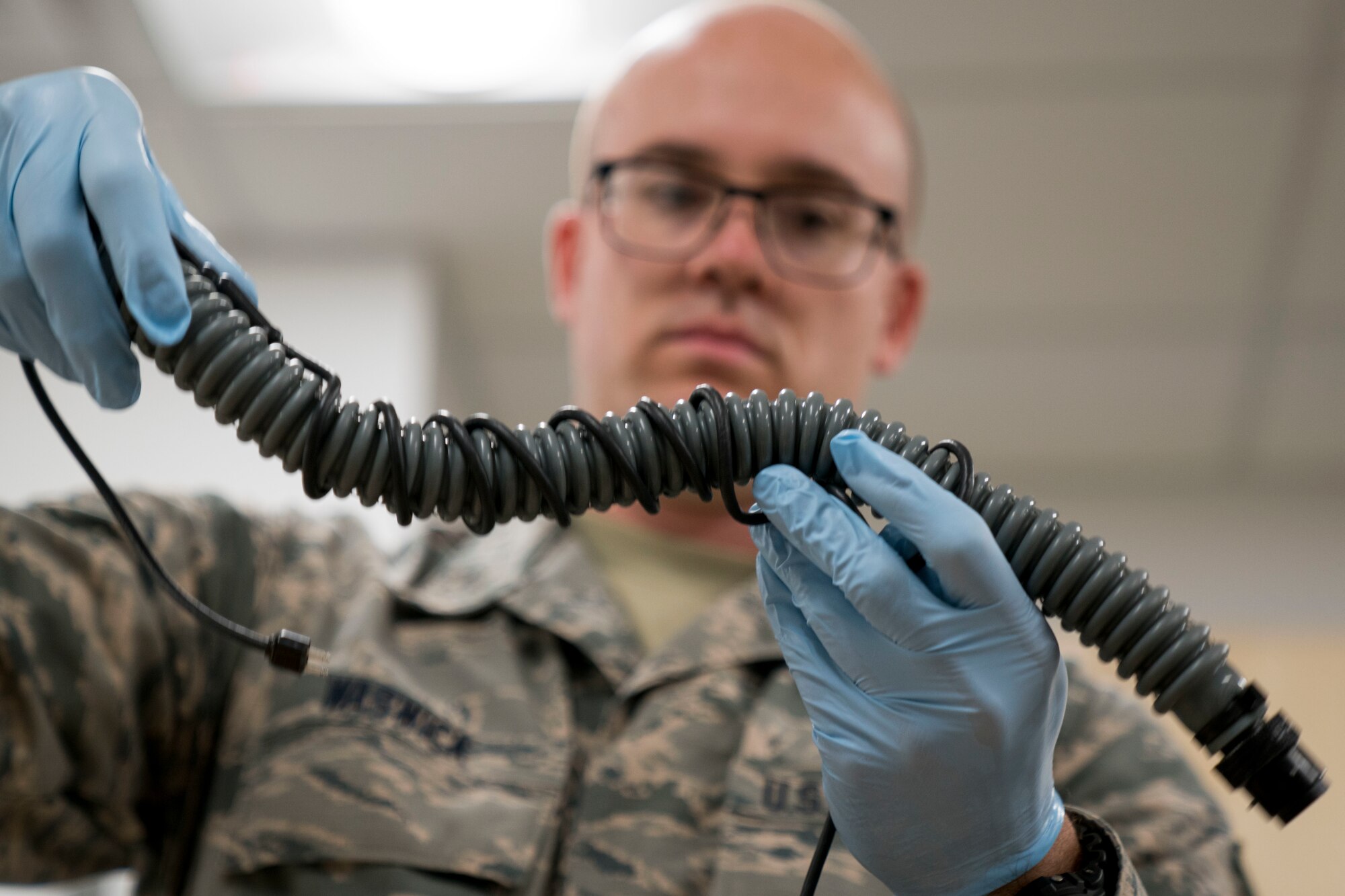 Staff Sgt. Miles Warwick inspects AFE equipment.