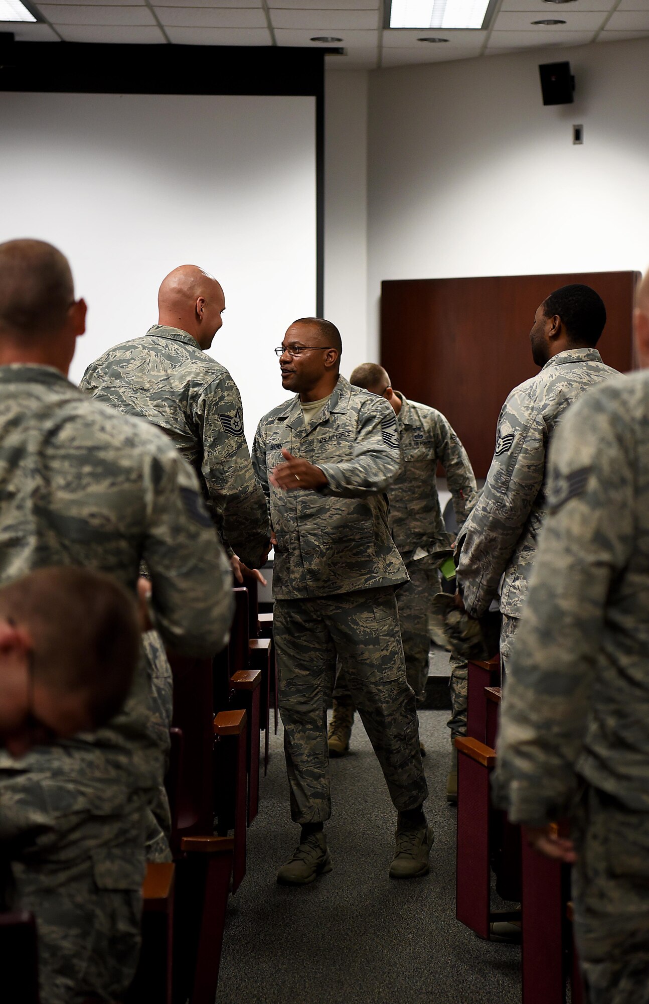 Chief Master Sgt. David Brown, 19th Air Force command chief, greets airmen after an all call Aug. 6, 2018, on Columbus Air Force Base, Mississippi. He held an all call for staff and technical sergeants on Columbus AFB and spoke lightly about his career and what actions he thinks, from his experiences, would benefit today’s enlisted personnel. (U.S. Air Force photo by Airman 1st Class Keith Holcomb)