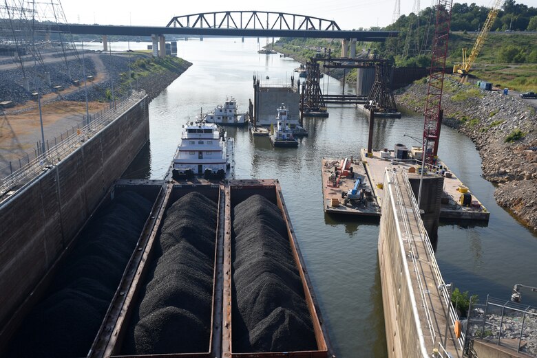 A 1.3 million pound concrete shell is moved to a gantry crane Aug. 2, 2018 downstream of Kentucky Lock in Grand Rivers, Ky. The U.S. Army Corps of Engineers Nashville District and contractor, Johnson Brothers, were preparing to place it on the riverbed where it will be part of a coffer dam and eventually a permanent part of the new lock wall for the Kentucky Lock Addition Project. It is the first of 10 shells that will be placed over the next year. The lock is located at Kentucky Dam, which is a Tennessee Valley Authority project at Tennessee River mile 22.4. (USACE Photo by Lee Roberts)