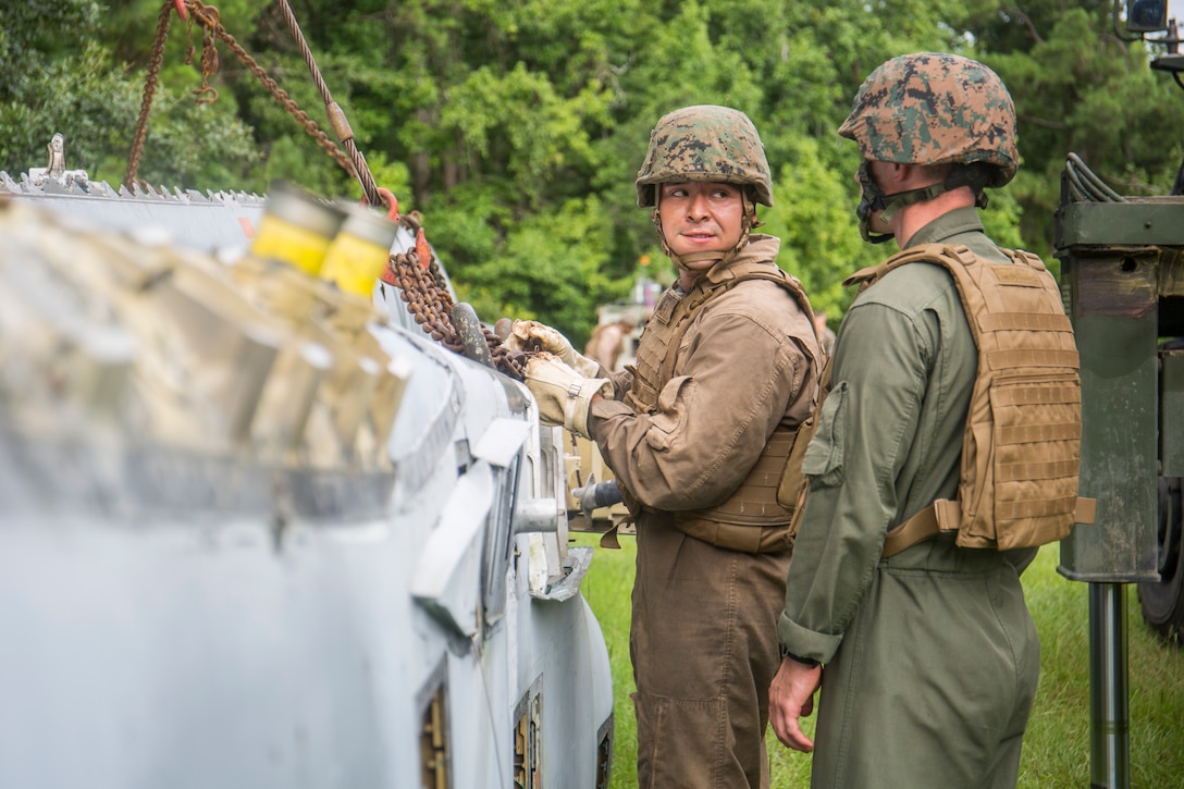 Sgt. Jose R. Trujillovargas secures a vehicle into a stable position during a Marine Corps Combat Readiness Evaluation aboard Marine Corps Air Station Beaufort Aug. 2. Trujillovargas is a motor transport operator for Marine Wing Support Detachment (MWSD) 31.