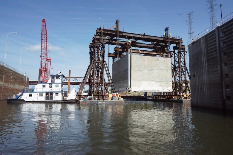 The U.S. Army Corps of Engineers Nashville District and its contractor partner Johnson Brothers put a 1.3 million pound concrete shell into position Aug. 6, 2018 on the riverbed on downstream end of Kentucky Lock where it will be part of a coffer dam and eventually a permanent part of the new lock wall for the Kentucky Lock Addition Project. It is the first of 10 shells that will be placed over the next year. The lock is located at Kentucky Dam, which is a Tennessee Valley Authority project at Tennessee River mile 22.4. (USACE Photo by Mark Rankin)