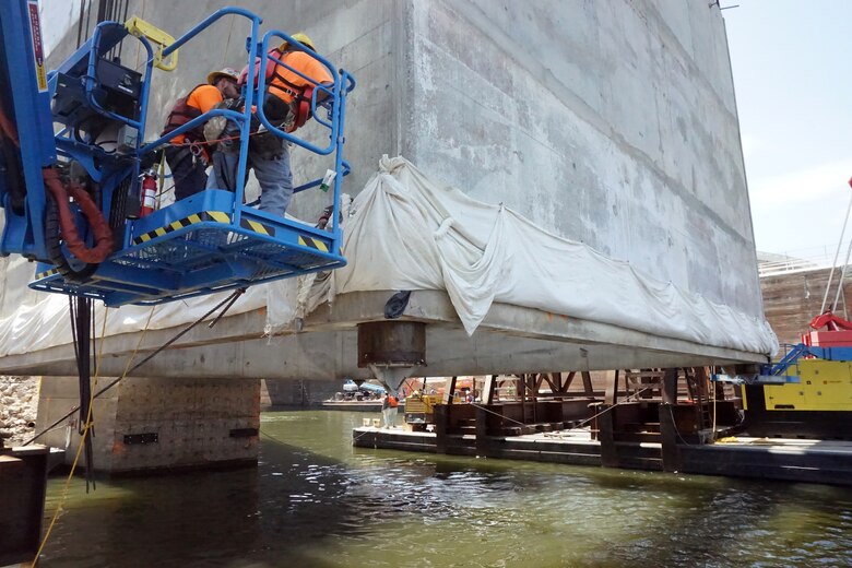 The U.S. Army Corps of Engineers Nashville District and its contractor partner Johnson Brothers put a 1.3 million pound concrete shell into position Aug. 6, 2018 on the riverbed on downstream end of Kentucky Lock where it will be part of a coffer dam and eventually a permanent part of the new lock wall for the Kentucky Lock Addition Project. It is the first of 10 shells that will be placed over the next year. The lock is located at Kentucky Dam, which is a Tennessee Valley Authority project at Tennessee River mile 22.4. (USACE Photo by Mark Rankin)