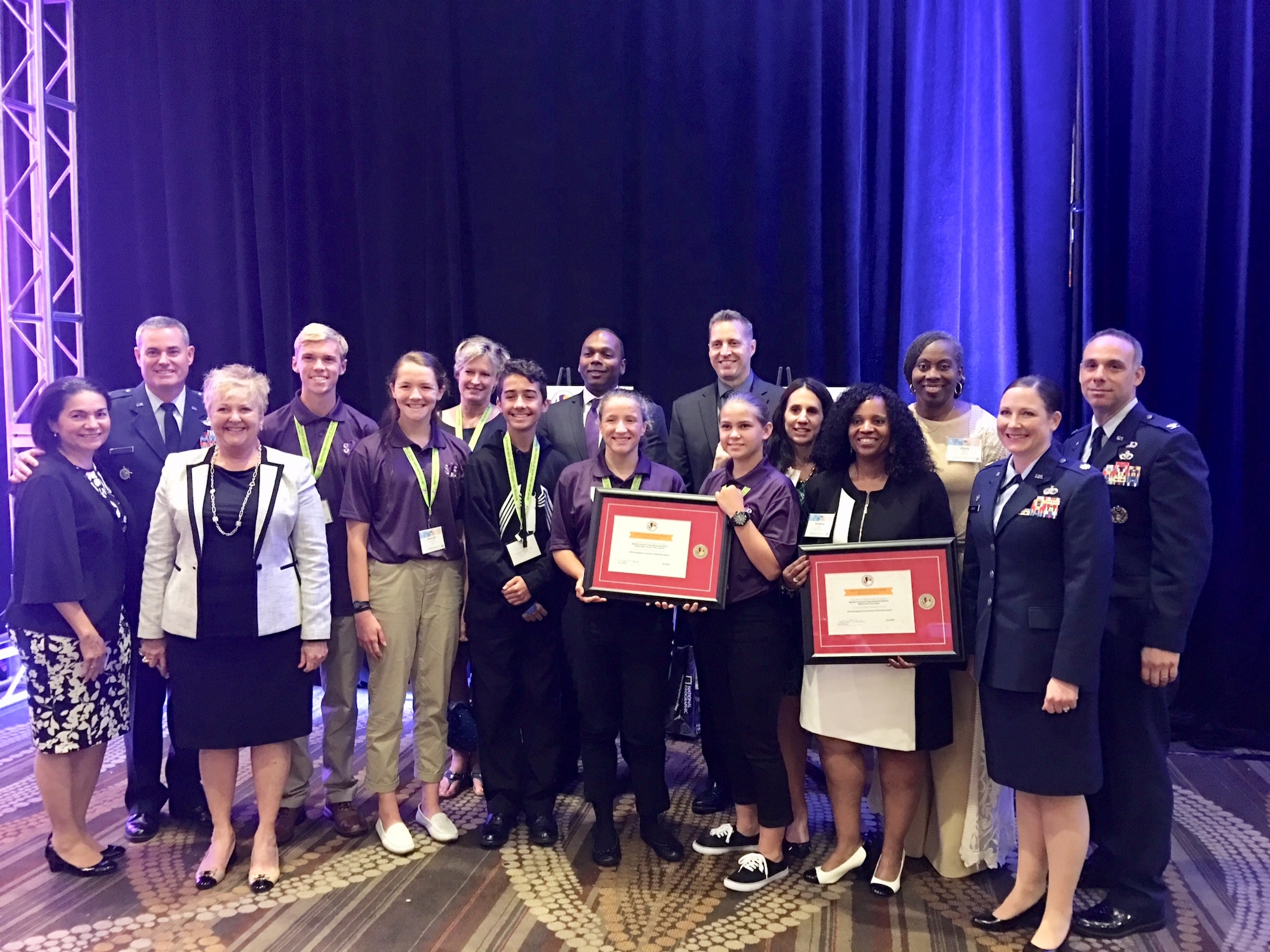Members of Team MacDill pause for a photo while receiving the Pete Taylor community partnership award.