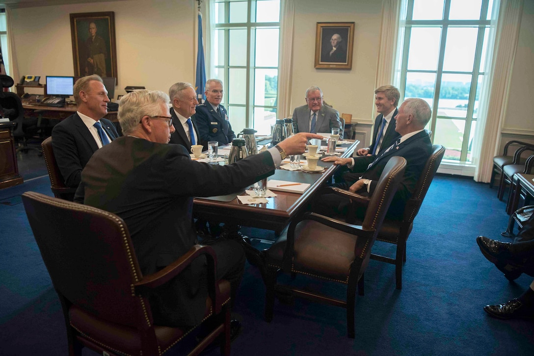 Vice President Mike Pence speaks to Defense Secretary James N. Mattis and other people during a meeting at the Pentagon.