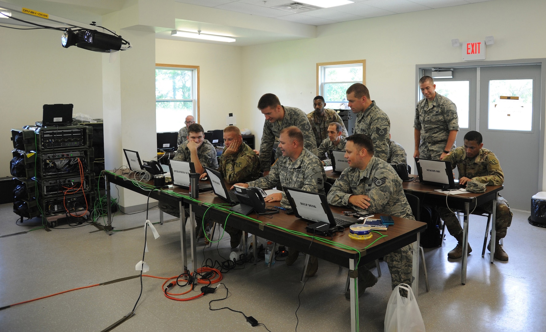 Airmen and Soldiers gather during Exercise Patriot Warrior for cyber defense training on Aug. 8, 2018, at Fort McCoy, Wisc. Patriot Warrior is Air Force Reserve Command’s premier exercise, providing an opportunity for Reserve Citizen-Airmen to train with joint partners in the combat support training exercise.