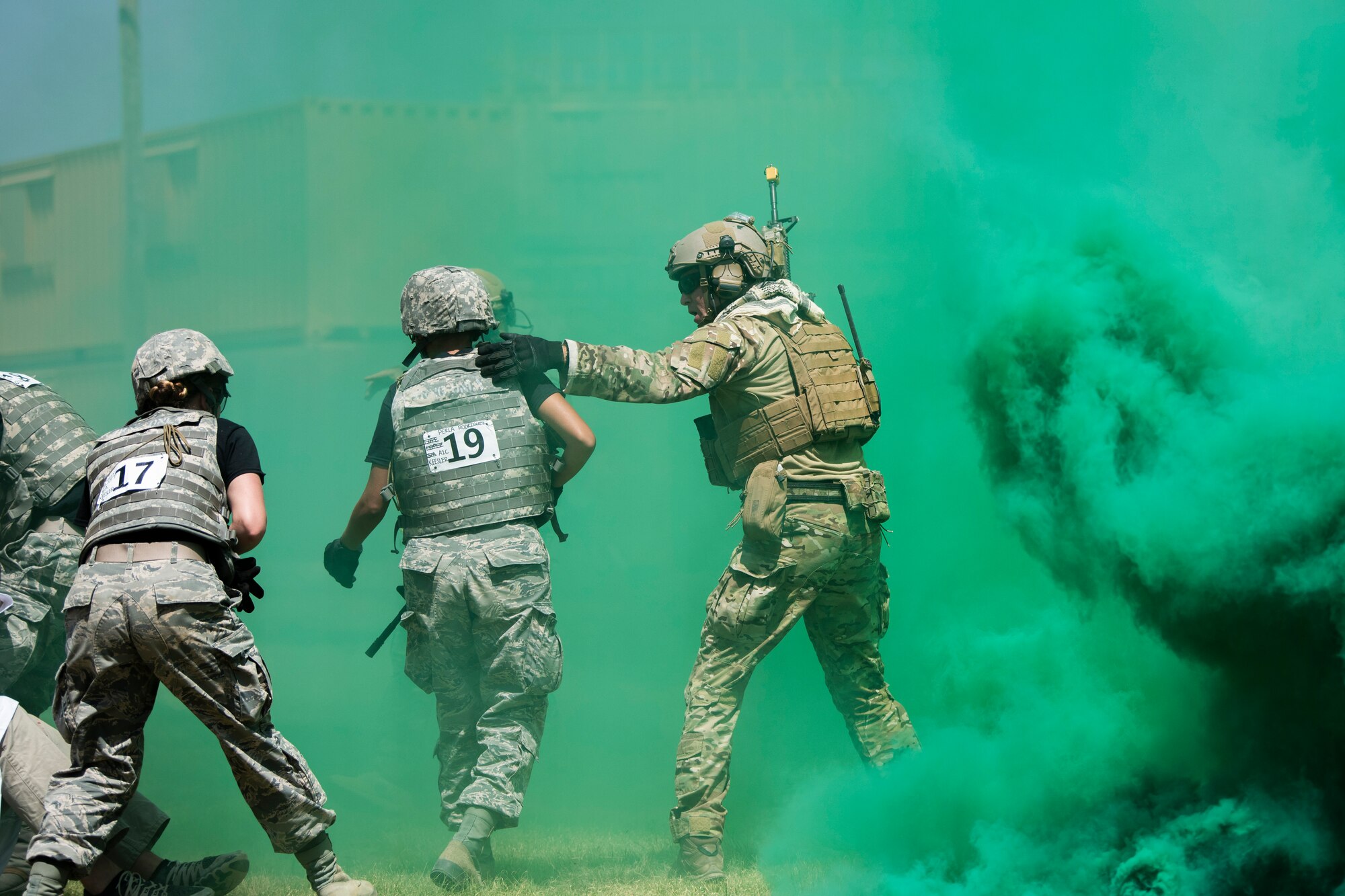An Airman escorts medical technicians from Keesler Air Force Base, Miss., to safety during a simulated attack at the Emergency Medical Technician Rodeo at Melrose Air Force Range, N.M., August 8, 2018. A total of 21 Air Force bases from around the world visited MAFR and Cannon Air Force Base, New Mexico, to participate in the EMT Rodeo, giving the technicians a wide assortment of scenarios to test their knowledge and training in the medical field. (U.S. Air Force photo by Airman 1st Class Gage Adison Daniel)