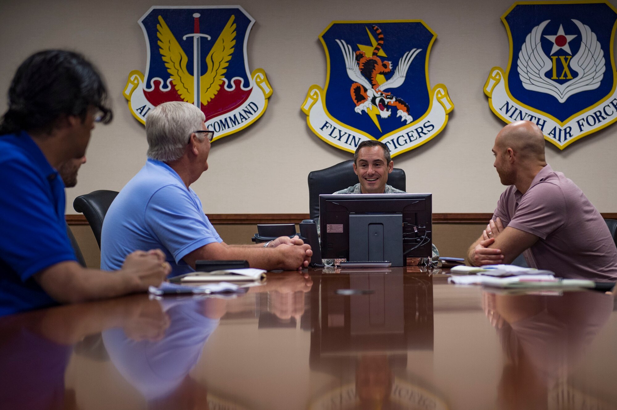 Col. Justin Demarco, center, 23d Wing vice commander, talks to analysts from the RAND Corporation during a visit, Aug. 8, 2018, at Moody Air Force Base, Ga. RAND integrated with Moody’s rescue, flying and maintenance professionals to examine firsthand Air Force operations. This familiarization helps RAND develop their analysis to ultimately present policy recommendations to Air Force decision makers. Since 1948, RAND has performed analysis for the U.S. Air Force. (U.S. Air Force photo by Senior Airman Greg Nash)
