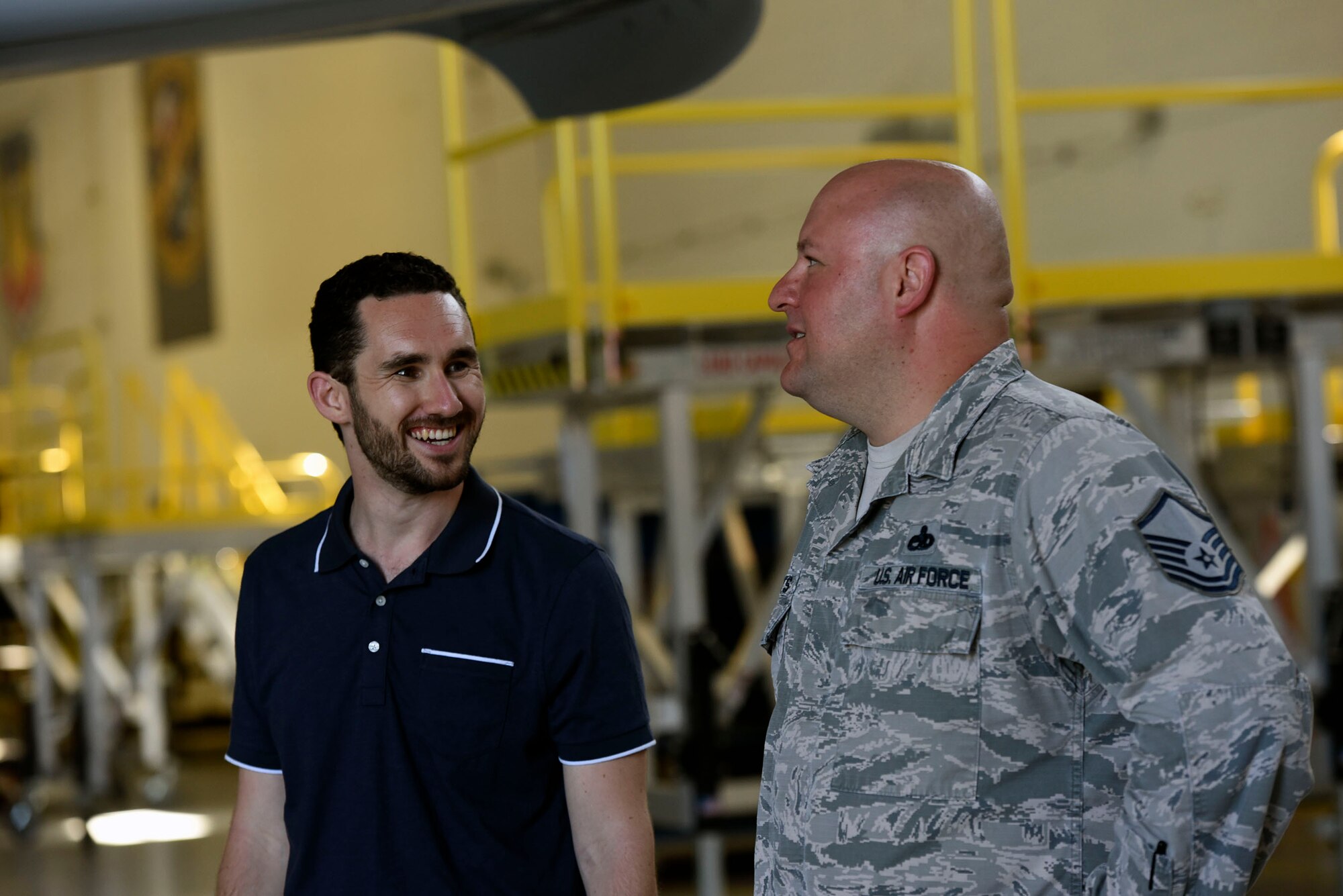 Master Sgt. Jason Butts, right, 23d Maintenance Squadron A-10C Thunderbolt II phase section chief, explains the functions of an A-10 to Colby Steiner, RAND Corporation associate physical scientist, during a visit, Aug. 8, 2018, at Moody Air Force Base, Ga. RAND integrated with Moody’s rescue, flying and maintenance professionals to examine firsthand Air Force operations. This familiarization helps RAND develop their analysis to ultimately present policy recommendations to Air Force decision makers. Since 1948, RAND has performed analysis for the U.S. Air Force. (U.S. Air Force photo by Senior Airman Greg Nash)