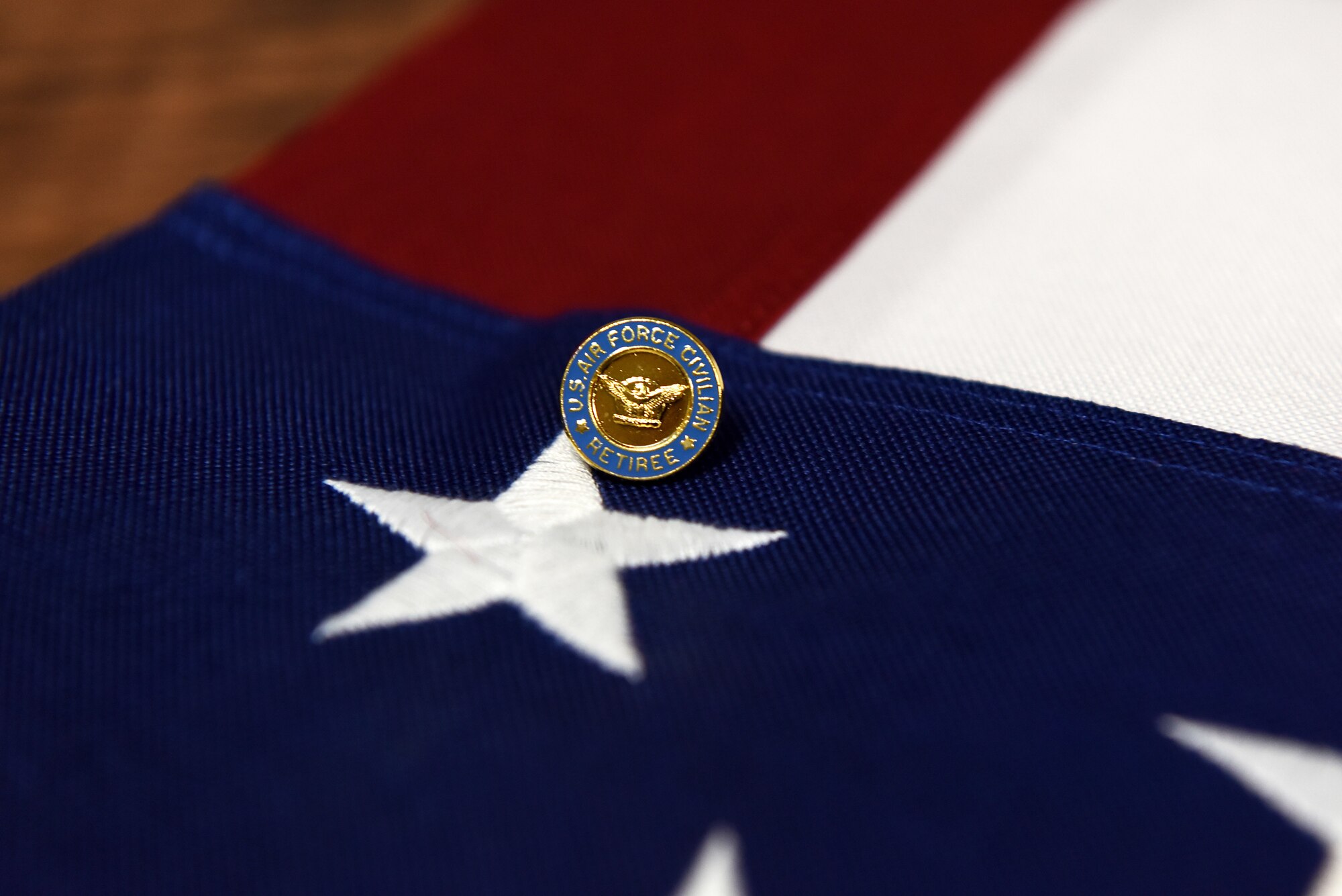 An Air Force civilian retirement pin is presented to Patricia Speights, former 14th Operations Group secretary, Aug. 3, 2018, on Columbus Air Force Base, Mississippi. At Columbus AFB alone, Speights served along 14 operations group commanders. (U.S. Air Force photo by Airman 1st Class Beaux Hebert)