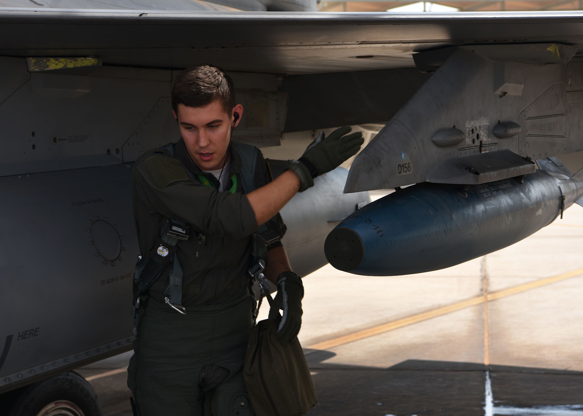 U.S. Air Force 1st Lt. Robert Lowery, a 310th Fighter Squadron F-16 Fighting Falcon student pilot, completes a final check to ensure the safety of the aircraft, Aug. 8, 2018 at Luke Air Force Base, Ariz.