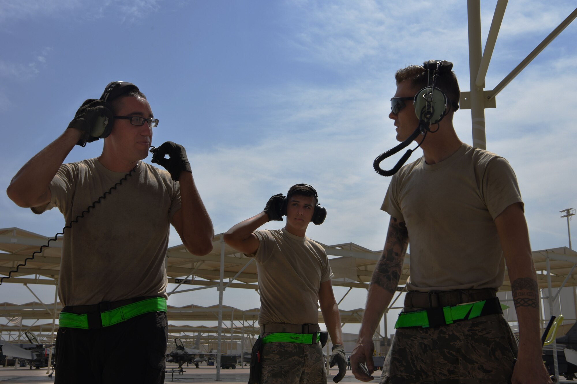 Members of the 310th Aircraft Maintenance Unit, discuss the final check on an F-16 Fighting Falcon, Aug. 8, 2018 at Luke Air Force Base, Ariz.