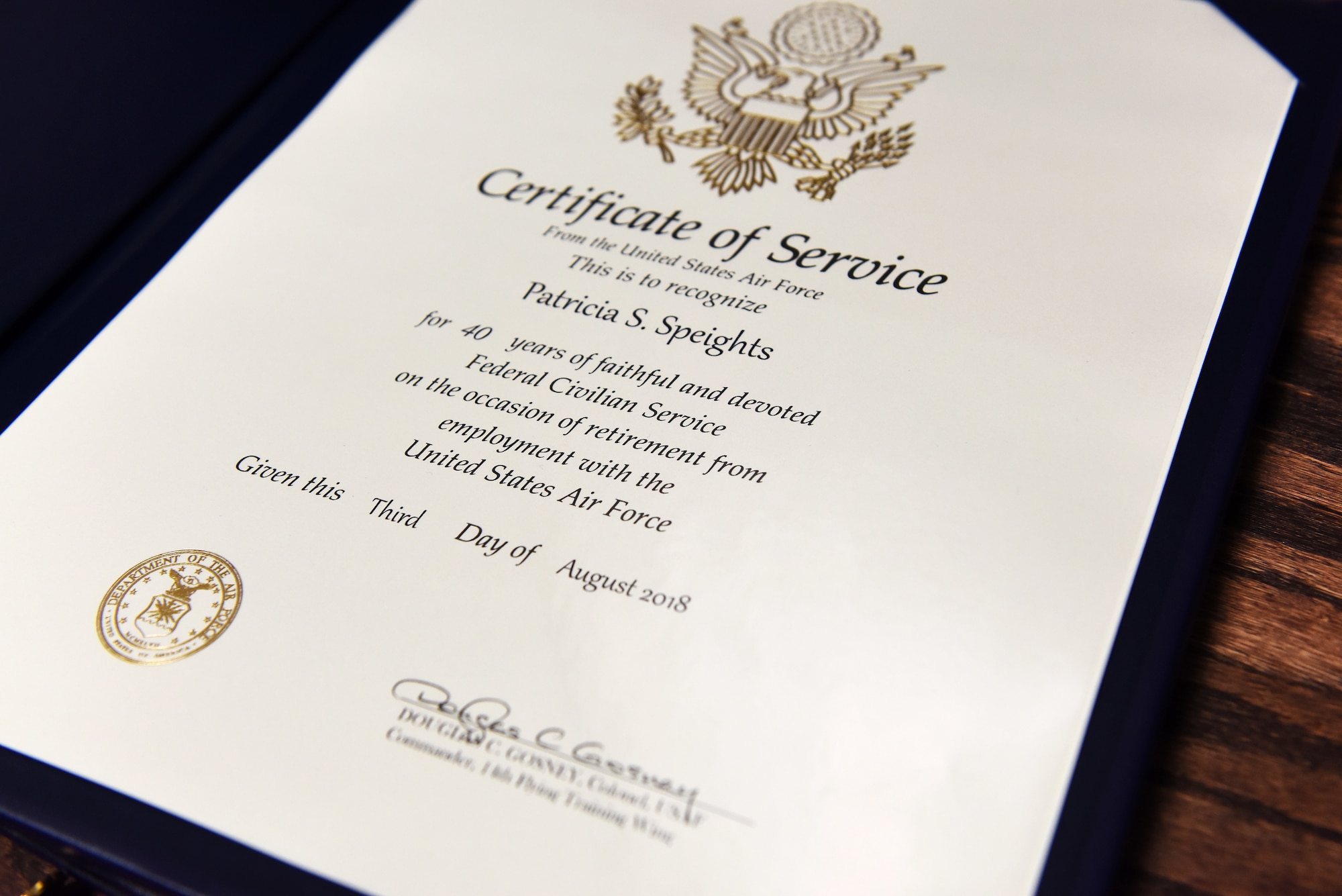 A Certificate of Service presented to Patricia Speights, former 14th Operations Group secretary, Aug. 3, 2018, on Columbus Air Force Base, Mississippi. Speights completed 40 years of civil service at three separate Air Force installations, finishing with Columbus AFB. (U.S. Air Force photo by Airman 1st Class Beaux Hebert)