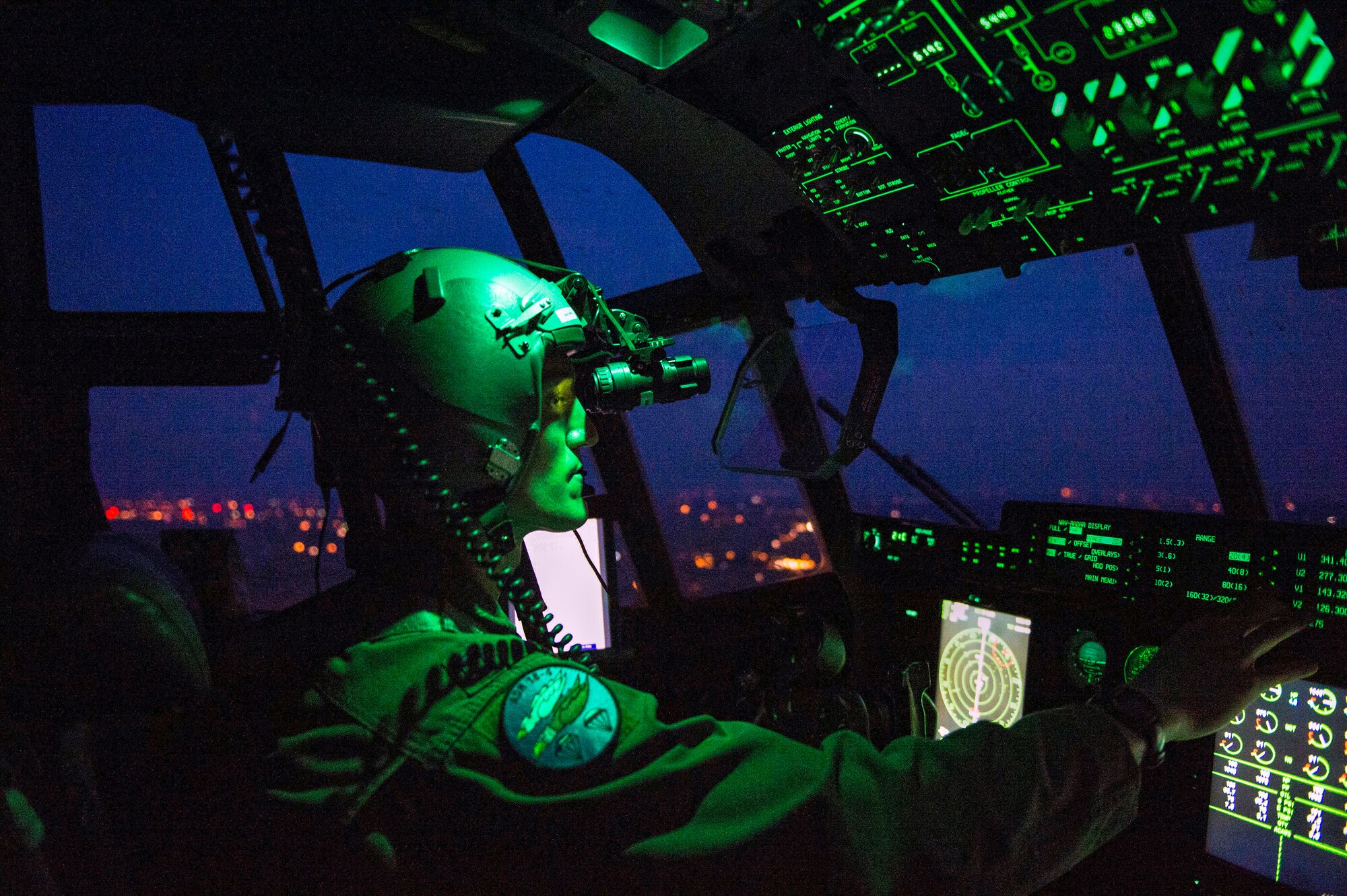 Capt. Leland Quinter, 37th Airlift Squadron C-130J Super Hercules pilot, wears night vision goggles during a training flight over Poland Aug. 2, 2018. C-130J pilots train to fly in multiple complex scenarios in various atmospheric conditions. (U.S. Air Force photo by Senior Airman Joshua Magbanua)