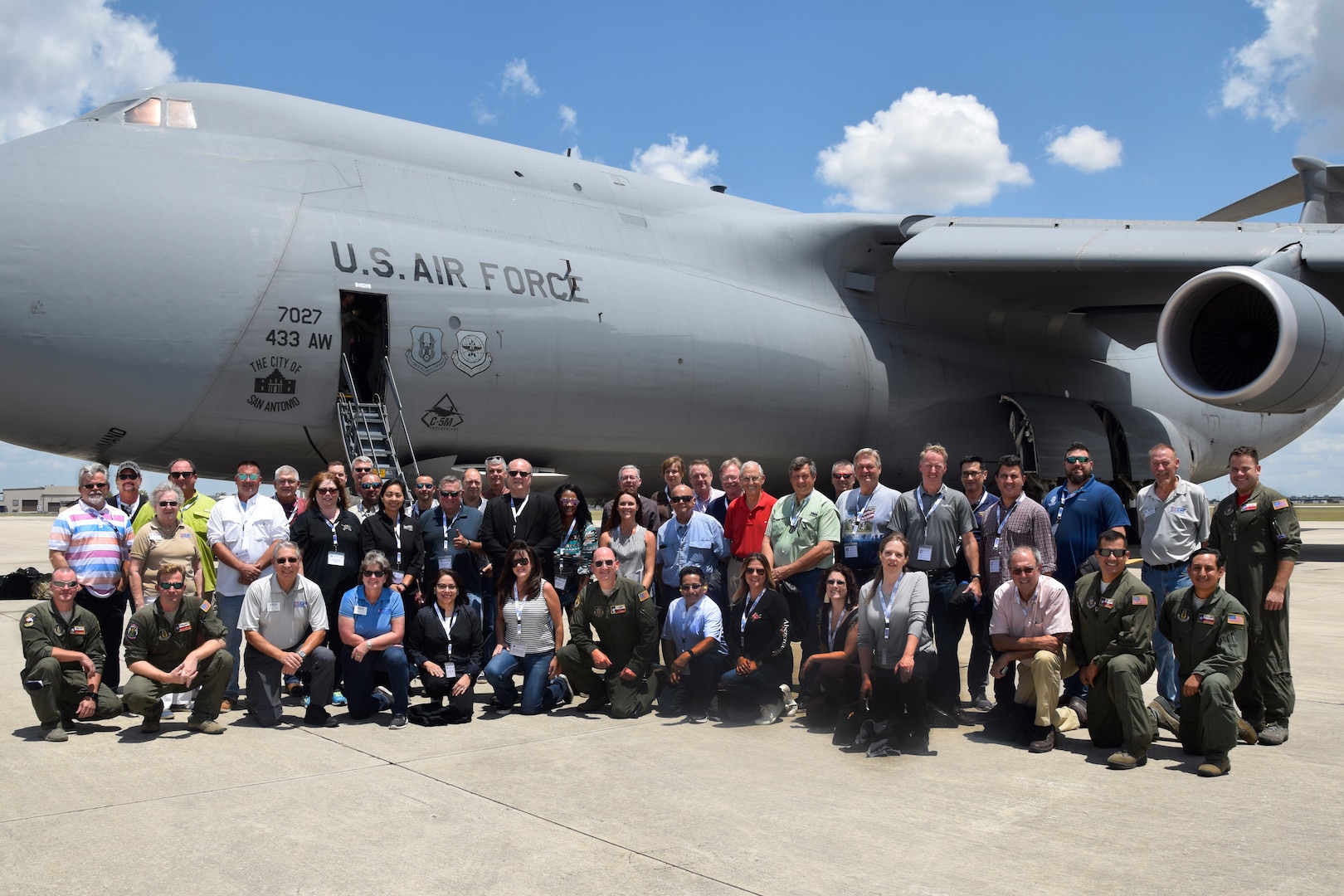 A 433rd Airlift Wing aircrew, 33 civilian employers and Texas Employer Support of the Guard and Reserve program volunteers take a moment after an Operation Bosslift flight onboard a C-5M Super Galaxy at Joint Base San Antonio-Lackland, Texas, Aug. 4, 2018. The event highlighted the 433rd Airlift Wing's mission to employers of the Alamo Wing’s Reserve Citizen Airmen, which includes providing massive strategic airlift for deployments and to supply combat and support forces worldwide. (U.S. Air Force photo by Staff Sgt. Lauren M. Snyder)