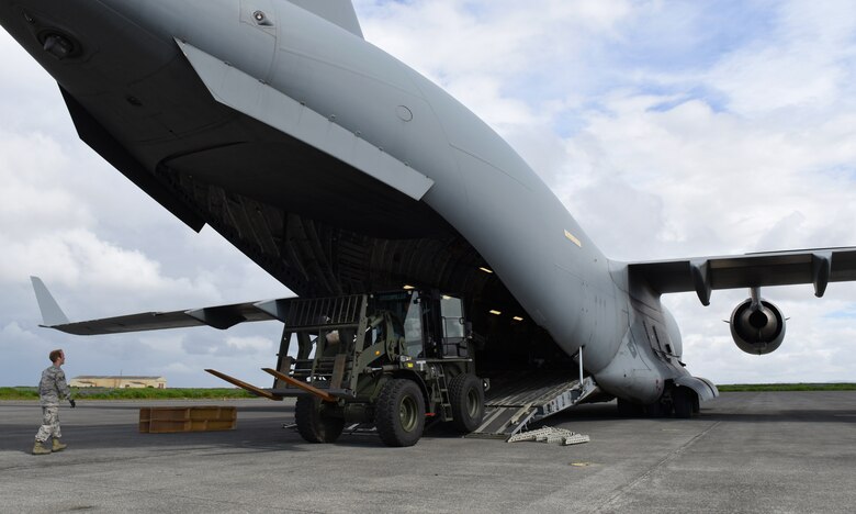 A fork lift drives off of a C-17 Globemaster III from the Heavy Airlift Wing, Pápa Air Base, Hungary, during NATO’s Icelandic Air Surveillance mission at Keflavik Air Base, Iceland, July 31, 2018. The 493rd Expeditionary Fighter Squadron airlifted in all the equipment needed to operate the full-scale IAS mission from the installation. (U.S. Air Force photo/Staff Sgt. Alex Fox Echols III)