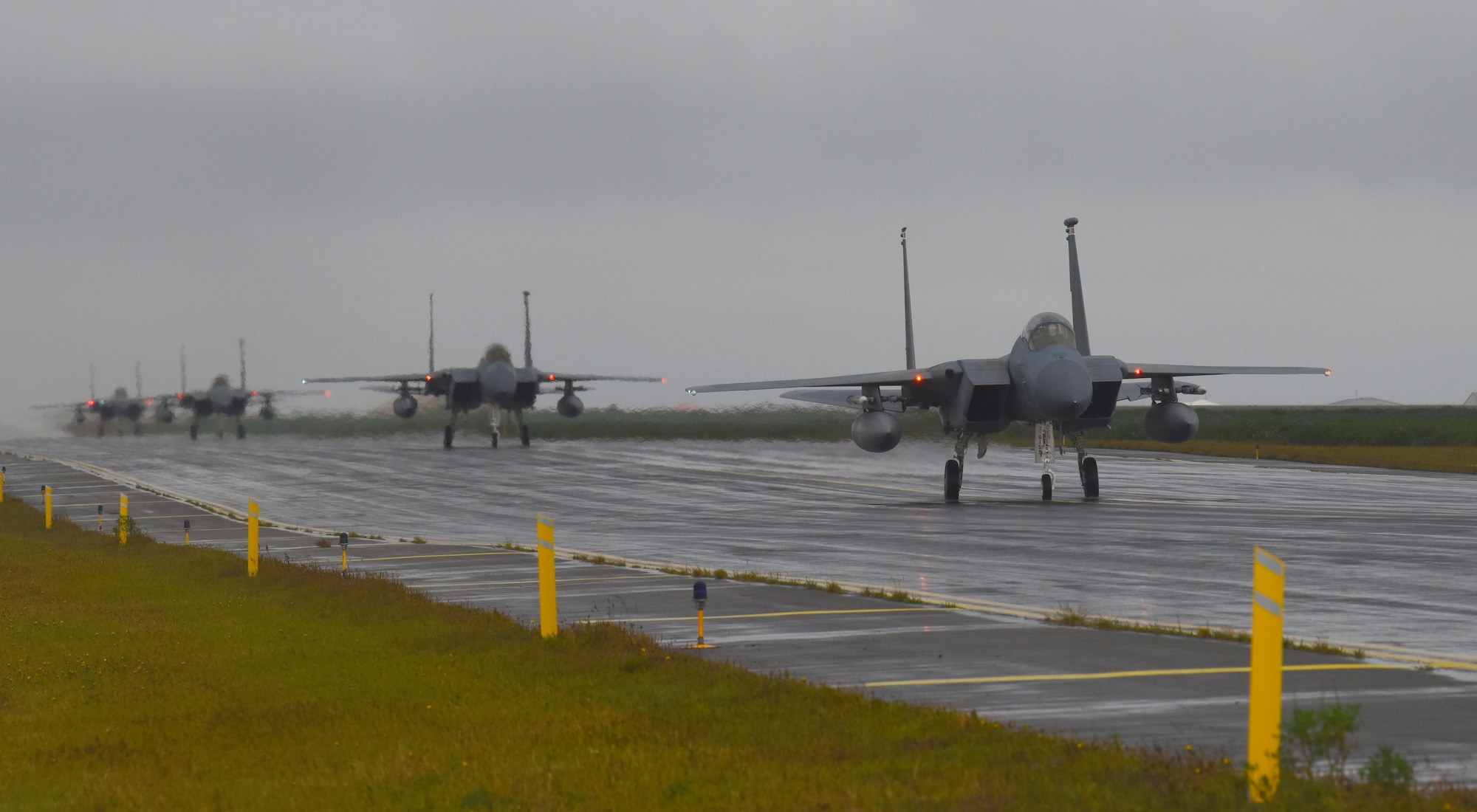 Four F-15C Eagle assigned to the 493rd Expeditionary Fighter Squadron taxi down the flightline after landing at Keflavik Air Base, Iceland, Aug. 3, 2018, in support of NATO’s Icelandic Air Surveillance mission. More than 250 U.S. Air Forces in Europe-Air Forces Africa Airmen and 14 F-15C/D Eagles deployed from Royal Air Force Lakenheath, England, with additional support from U.S. Airmen assigned to Aviano Air Base, Italy, Royal Air Force Mildenhall, England, and Ramstein Air Base, Germany. (U.S. Air Force photo/Staff Sgt. Alex Fox Echols III)