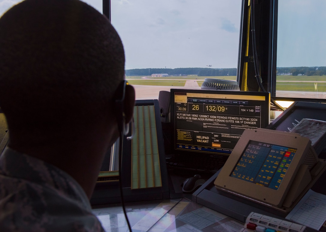 U.S. Air Force Senior Airman Gregory Gray, 1st Operations Support Squadron, air traffic controller, watches a U.S. Air Force T-38 Talon take off at Joint Base Langley-Eustis, Virginia, Aug. 6, 2018.
