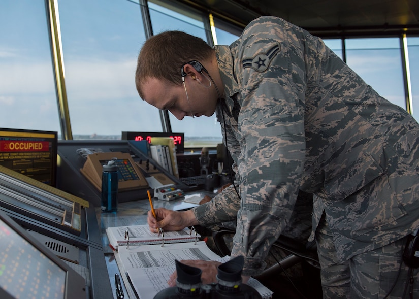 U.S. Air Force Airman 1st Class Niccolo Pufall, 1st Operations Support Squadron air traffic control apprentice, takes notes on tower procedures at Joint Base Langley-Eustis, Virginia, Aug. 6, 2018.