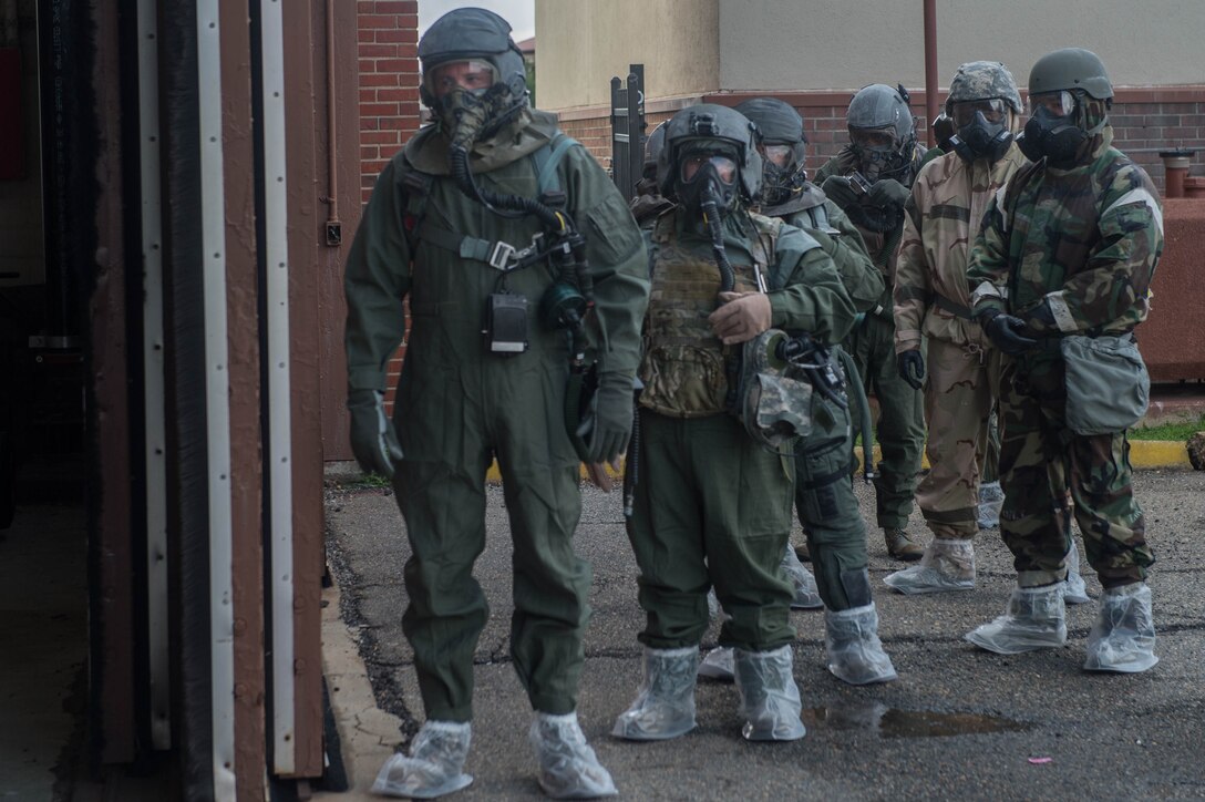 U.S. Air Force Airmen assigned to Aircrew Flight Equipment units from across the Air Force, prepare to go through an Aircrew Contamination Control Area during an exercise at Joint Base Langley-Eustis, Virginia, July 12, 2018. Airmen from aircrew flight equipment units from 17 U.S. Air Force wings, representing four major commands participated in the exercise. (U.S. Air Force photo by Senior Airman Derek Seifert)