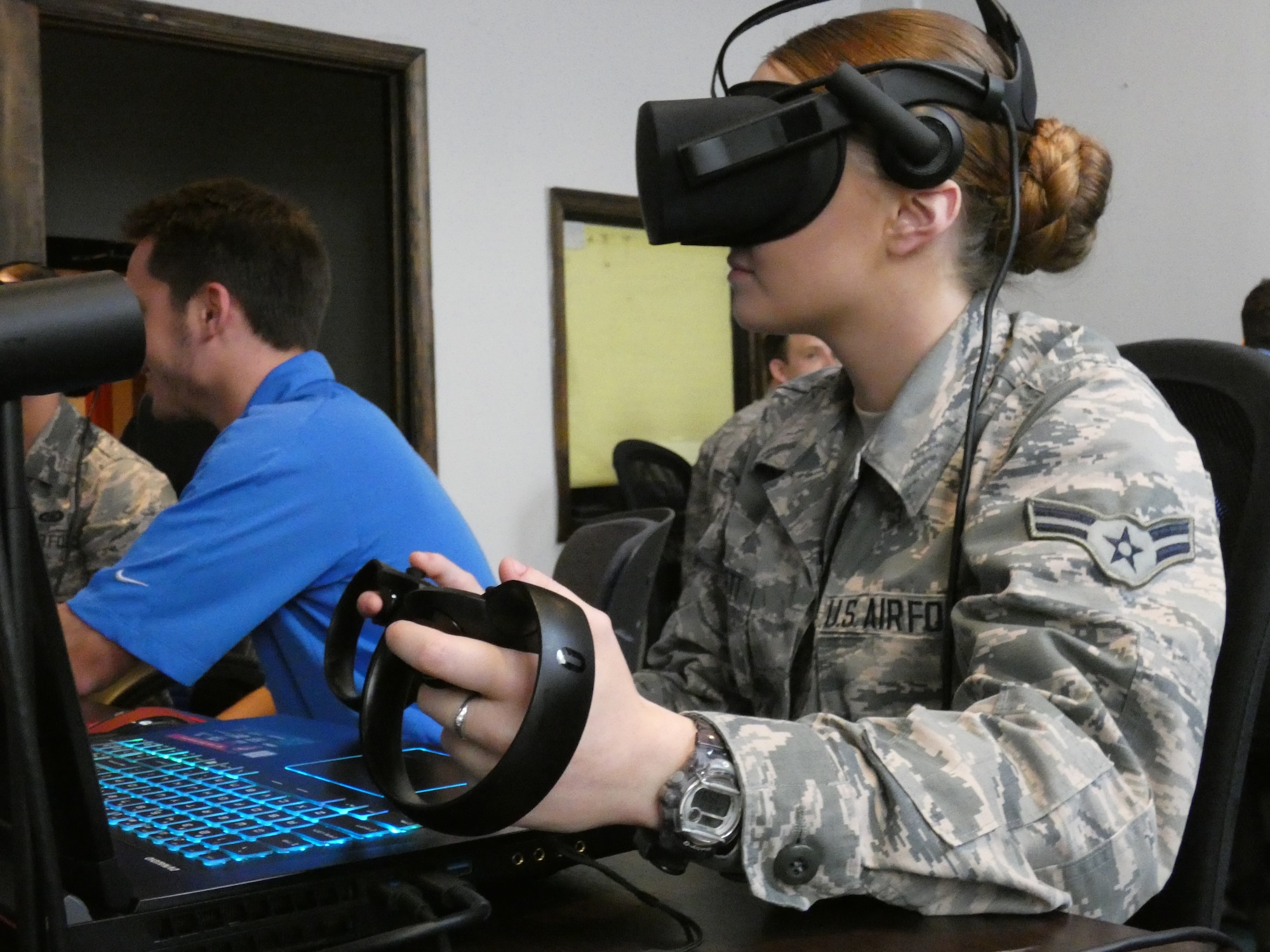 Airman 1st Class Lysle, 36th Intelligence Squadron, completes a virtual reality demo at a collaborative workspace in downtown Norfolk, Virginia.