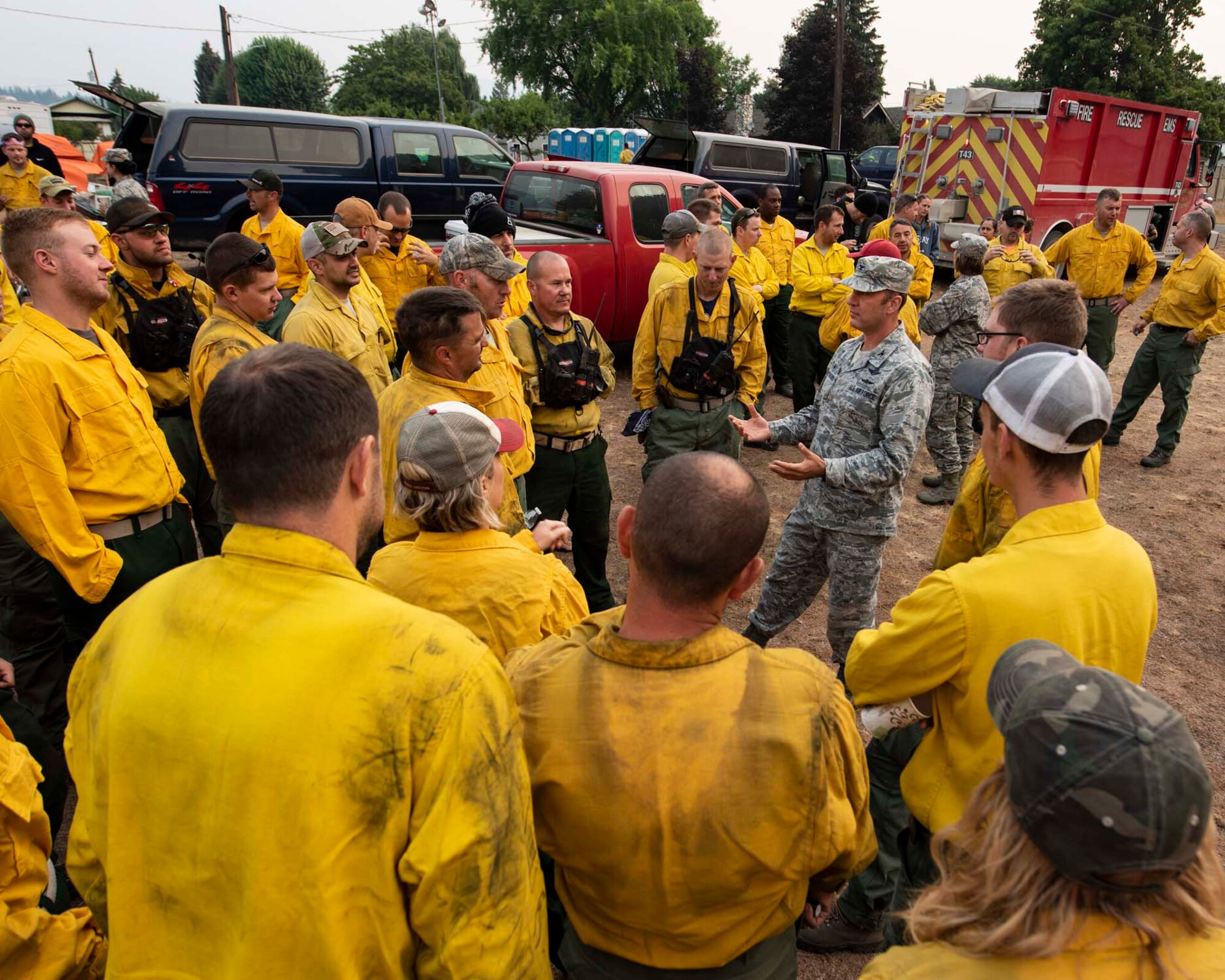 Col. Johan Deutscher, commander of the 141st Air Refueling Wing, greets guardsmen from the 141st who mobilized to Northport, Wash. to support firefighting efforts for the Sheep Creek fire August 8, 2018. Nearly 60 Guardsmen from the 141st ARW were mobilized to help support firefighting efforts throughout the region. (U.S. Air National Guard photo by Staff Sgt. Rose M. Lust)