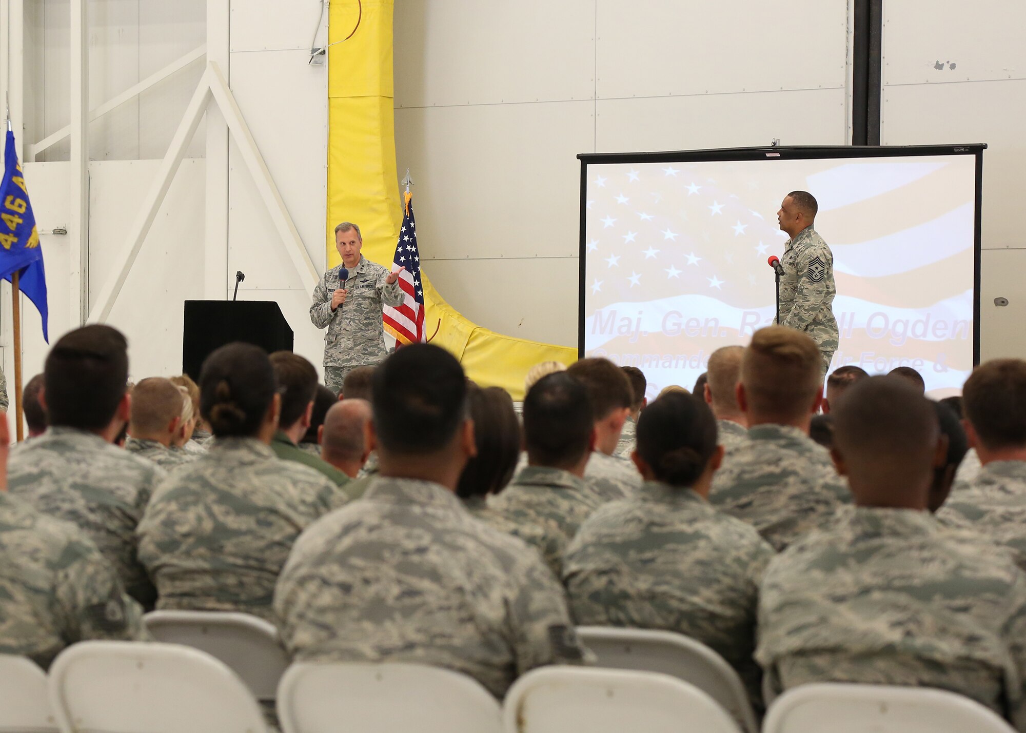 Maj. Gen. Odgen and Command Chief White address Rainier Wing Airmen during a Commander's Cal