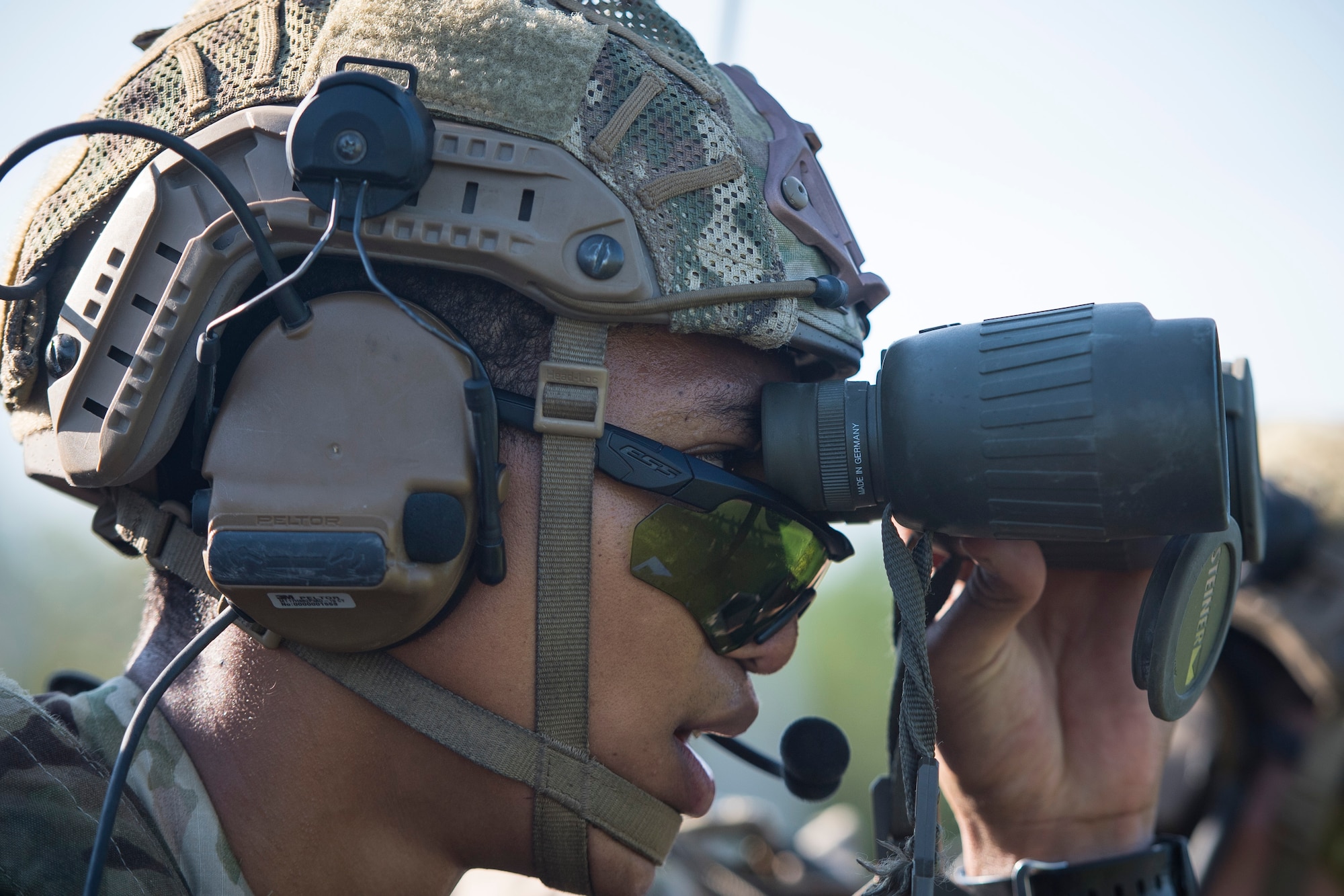 Senior Airman Tyler Hill, 20th Air Support Operations Squadron (ASOS) joint terminal attack controller (JTAC), uses binoculars to locate reference points during Draco Spear, Aug. 6, 2018, at Moody Air Force Base, Ga. Draco Spear is a revival of the mid-2000s joint-training event Dragon Challenge that tested the top JTACs from various air support operations squadrons both mentally and physically. (U.S. Air Force photo by Senior Airman Janiqua P. Robinson)