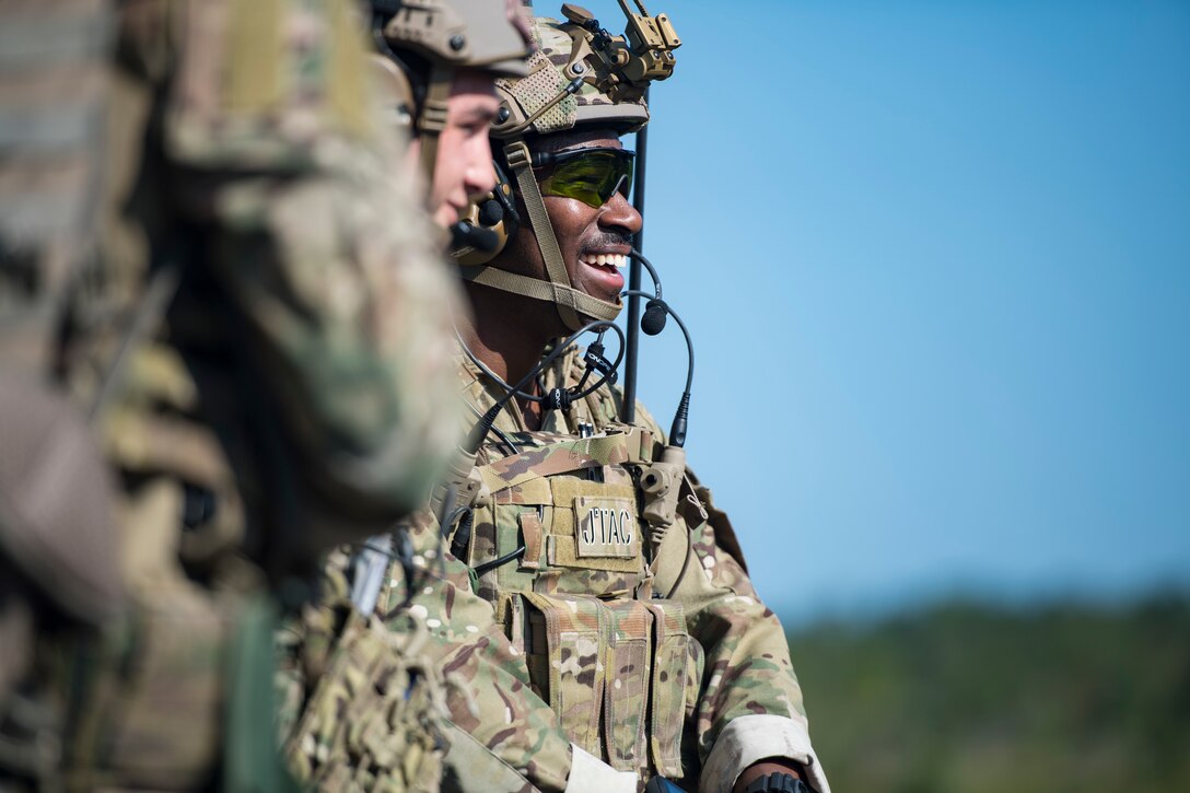 Staff Sgt. David Brown, 15th Air Support Operations Squadron (ASOS) joint terminal attack controller (JTAC), laughs after finishing a speed drill during Draco Spear, Aug. 6, 2018, at Moody Air Force Base, Ga. Draco Spear is a revival of the mid-2000s joint-training event Dragon Challenge that tested the top JTACs from various air support operations squadrons both mentally and physically. (U.S. Air Force photo by Senior Airman Janiqua P. Robinson)