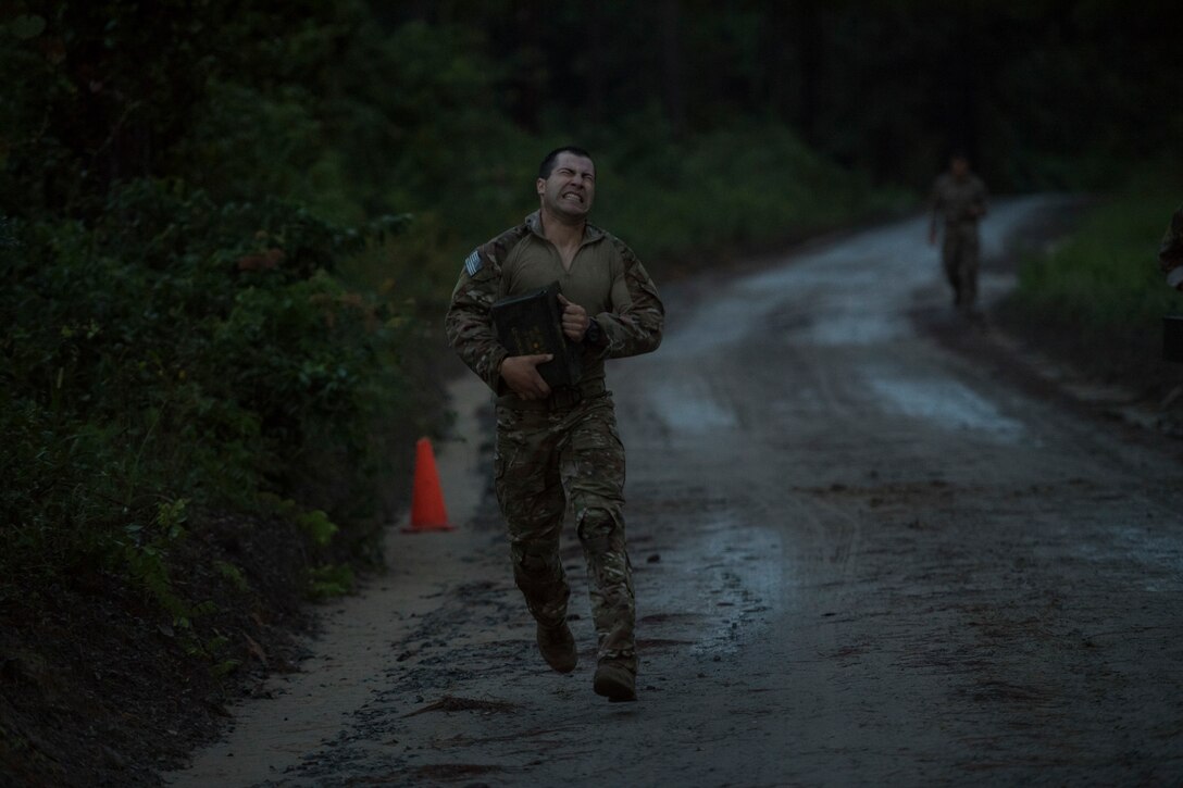 Staff Sgt. Ryan Holst, 19th Air Support Operations Squadron (ASOS) joint terminal attack controller, runs his final sprint during Draco Spear, Aug. 3, 2018, at Moody Air Force Base, Ga. Draco Spear is a revival of the mid-2000s joint-training event Dragon Challenge that tested the top JTACs from various air support operations squadrons both mentally and physically. (U.S. Air Force photo by Senior Airman Janiqua P. Robinson)