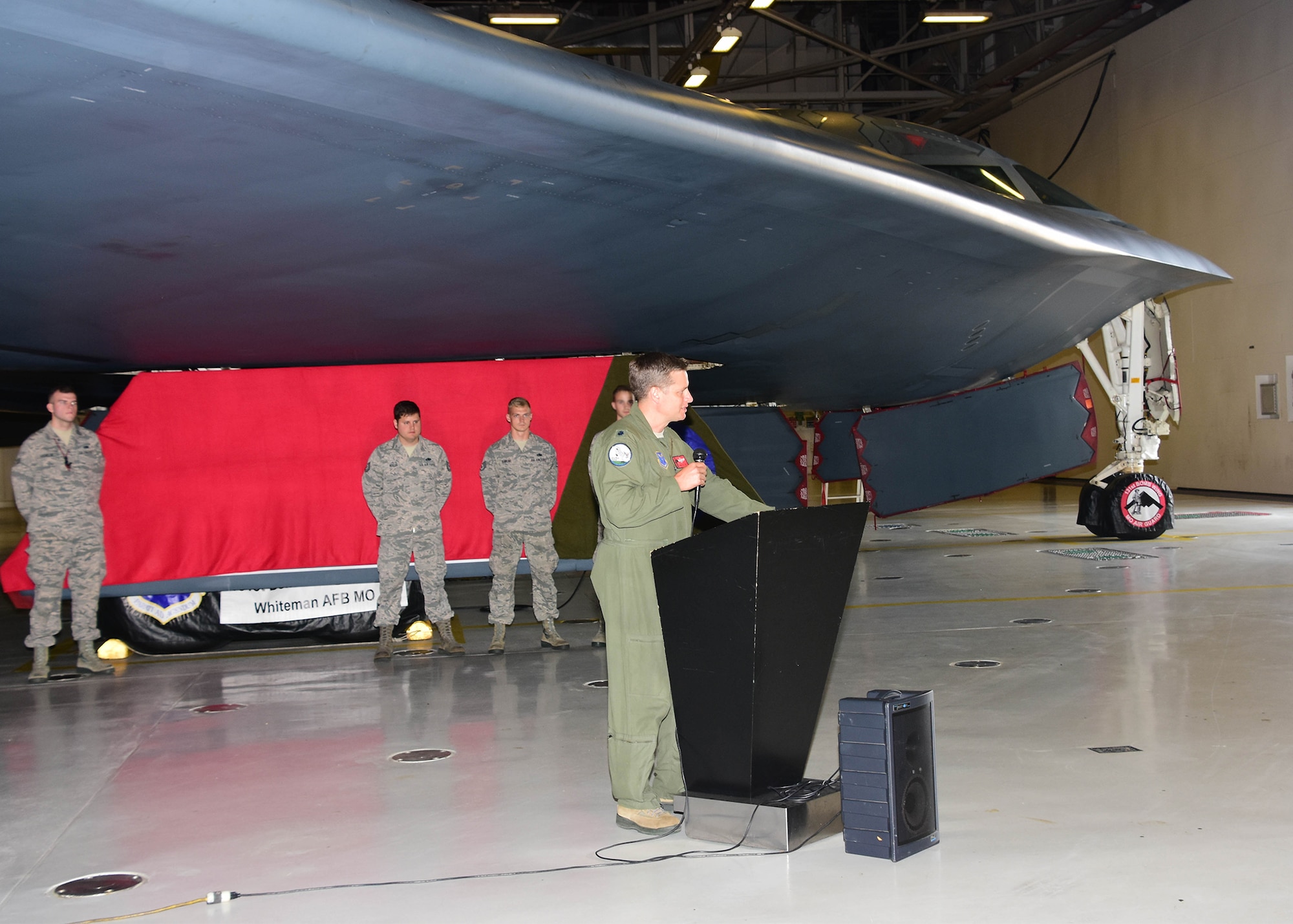 Lt. Col. Timothy Rezac, commander of the 110th Bomb Squadron, a subordinate unit of the Missouri Air National Guard’s 131st Bomb Wing, addresses the audience prior to the unveiling of a new paint scheme with the slogan “Lindbergh’s Own” on a gear door for the Spirit of Nebraska, a B-2 bomber, at Whiteman Air Force Base, Missouri, Aug. 4, 2018. The slogan commemorates the late Charles A. Lindbergh, the unit’s most famous member. (U.S. Air National Guard photo by Senior Master Sgt. Mary Dale Amison)