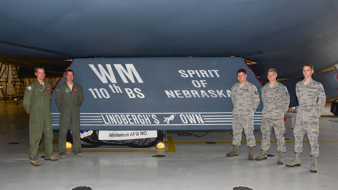The dedicated pilots and aircraft crew chiefs for the Spirit of Nebraska, a B-2 bomber, gather after a new paint scheme with the slogan “Lindbergh’s Own” on a gear door was unveiled at Whiteman Air Force Base, Missouri, Aug. 4, 2018. The slogan is associated with the 110th Bomb Squadron, a subordinate unit of the Whiteman based 131st Bomb Wing, and commemorates the late Charles A. Lindbergh, the unit’s most famous member.